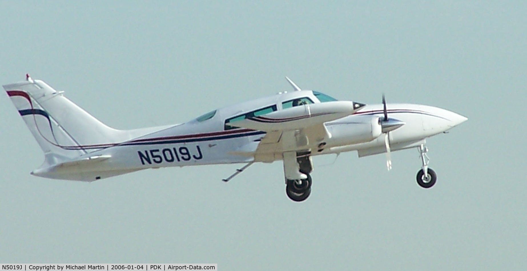 N5019J, 1974 Cessna 310R C/N 310R0139, Departing PDK - Starting to rotate gear.
