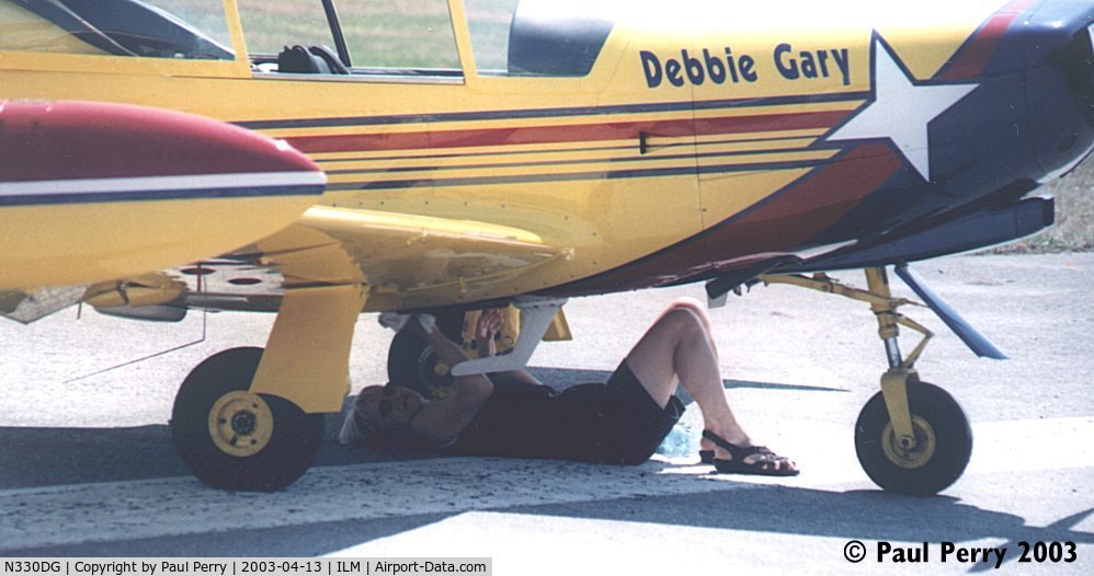 N330DG, 1991 SIAI-Marchetti SF-260D C/N 766, Debbie Gary checking things out before her routine.  Got to appreciate the hands on pilots