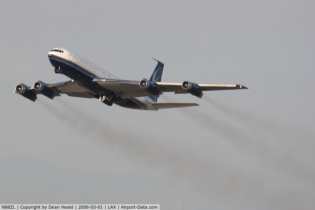 N88ZL, 1965 Boeing 707-330B C/N 18928, N88ZL climbing out from LAX RWY 25R trailing smoke from her engines.