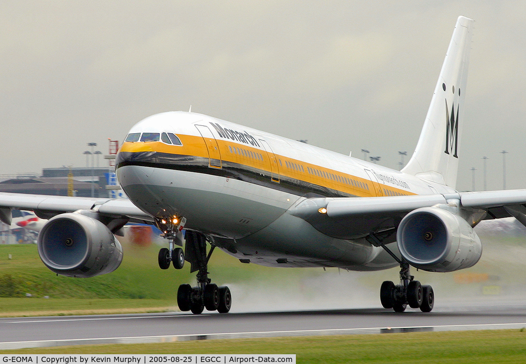 G-EOMA, 1999 Airbus A330-243 C/N 265, Monarch A.330 leaving a very wet 24L.