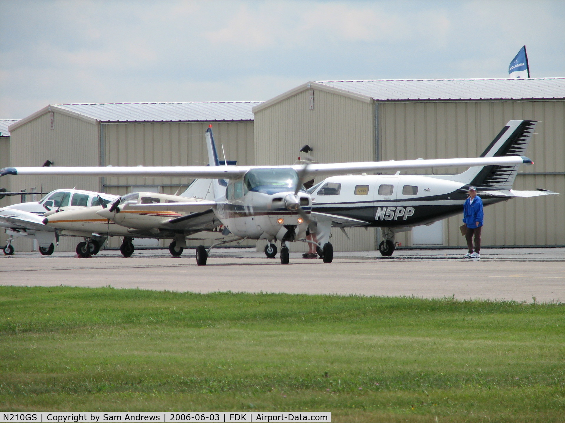 N210GS, 1976 Cessna 210L Centurion C/N 21061283, Taxiing out after a long working the booth at the AOPA Fly-in 2006