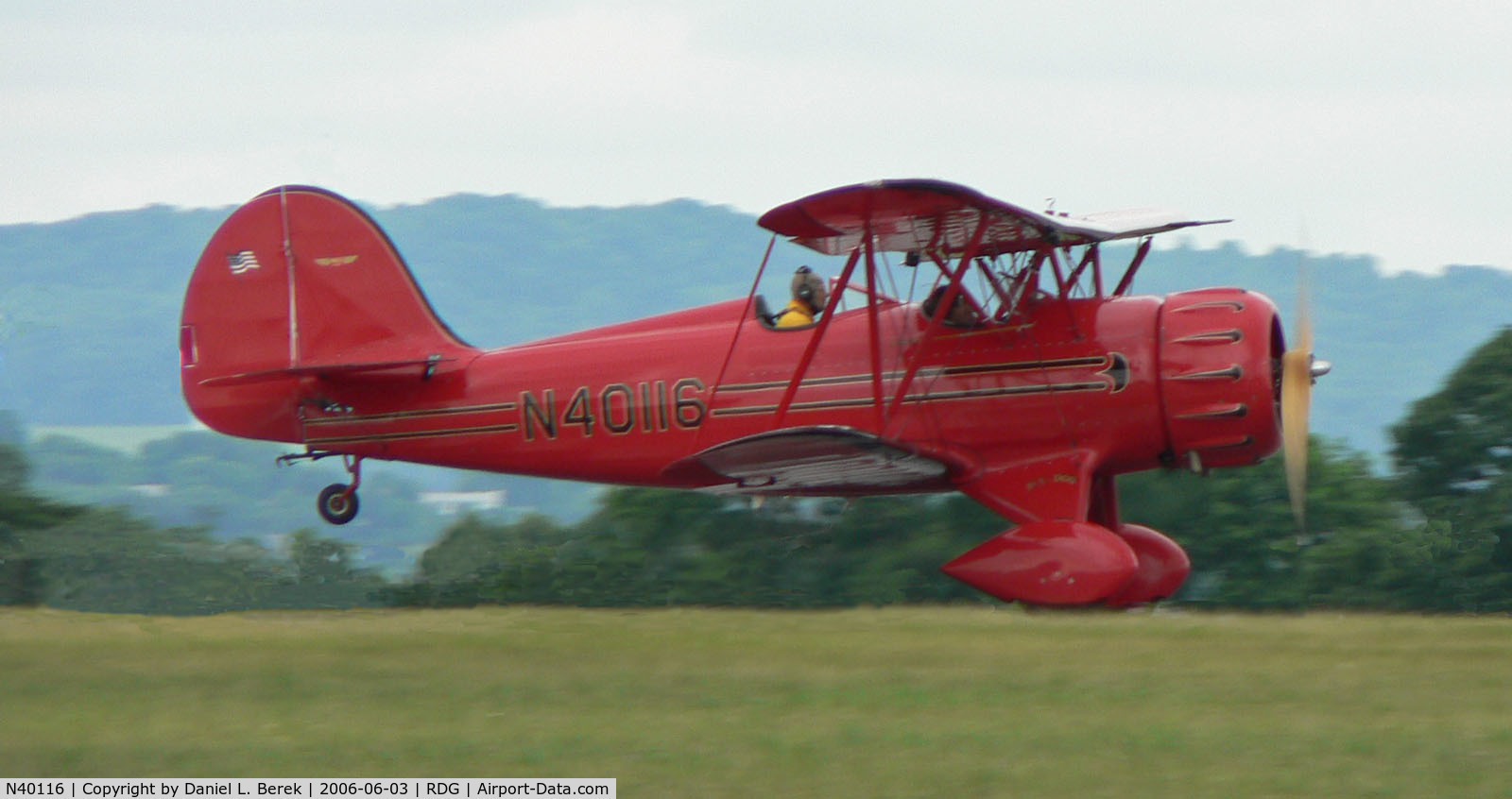 N40116, Classic Aircraft Corp WACO YMF C/N F5-024, Gleaming red Waco skims the Pennsylvania Dutch countryside.