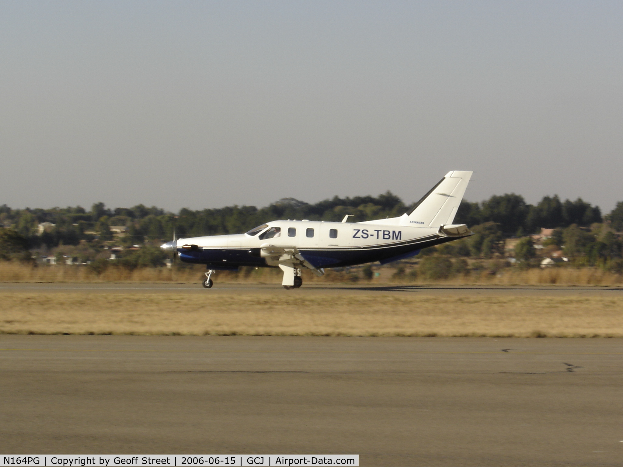 N164PG, Socata TBM-700 C/N 164, This aircraft is now registered ZS-TBM and is seen here landing at Grand Central Airport in Johannesburg South Africa.