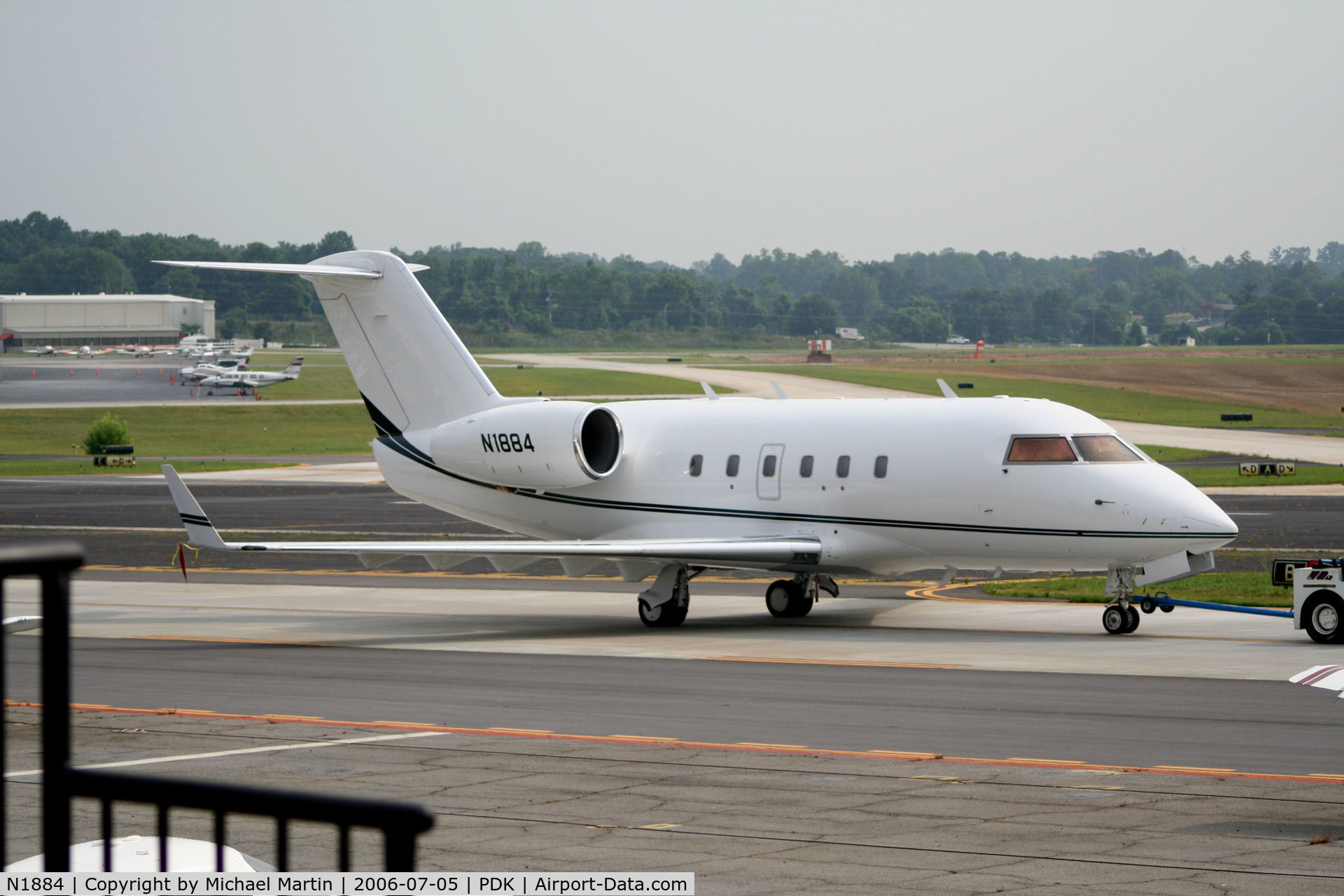 N1884, 1981 Canadair Challenger 600 (CL-600-1A11) C/N 1032, Being towed to parking at Mercury Air Center