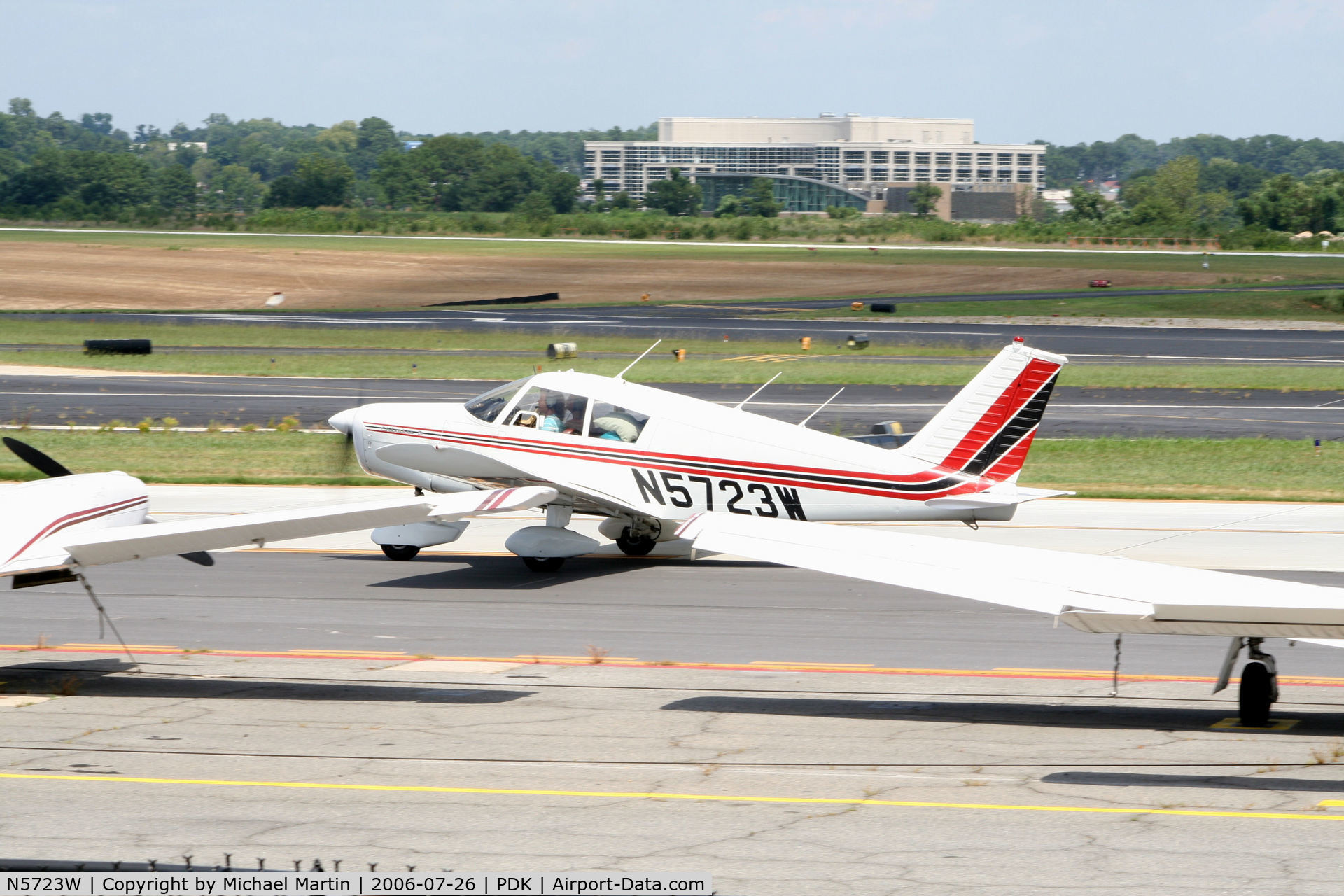 N5723W, 1963 Piper PA-28-160 Cherokee C/N 28-1281, Taxing past tied down aircraft