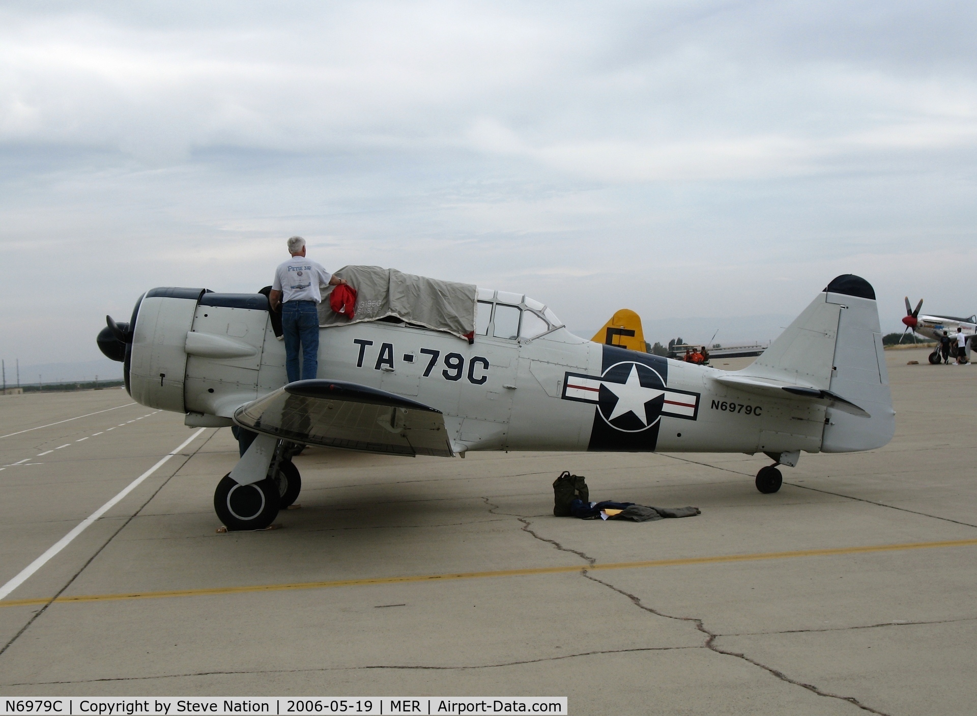 N6979C, North American AT-6D Texan C/N 42-85408, Putting the cover on AT-6D 42-85408 (ain't no sun!) @ Castle AFB, CA