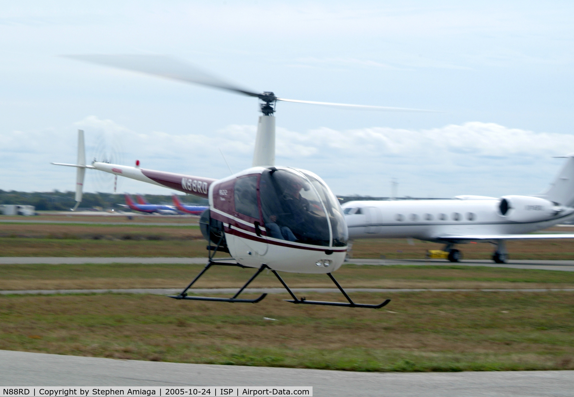 N88RD, 1992 Robinson R22 BETA C/N 2214, 88RD hover-taxiing from the Whiskey Pad with 745RS behind her.