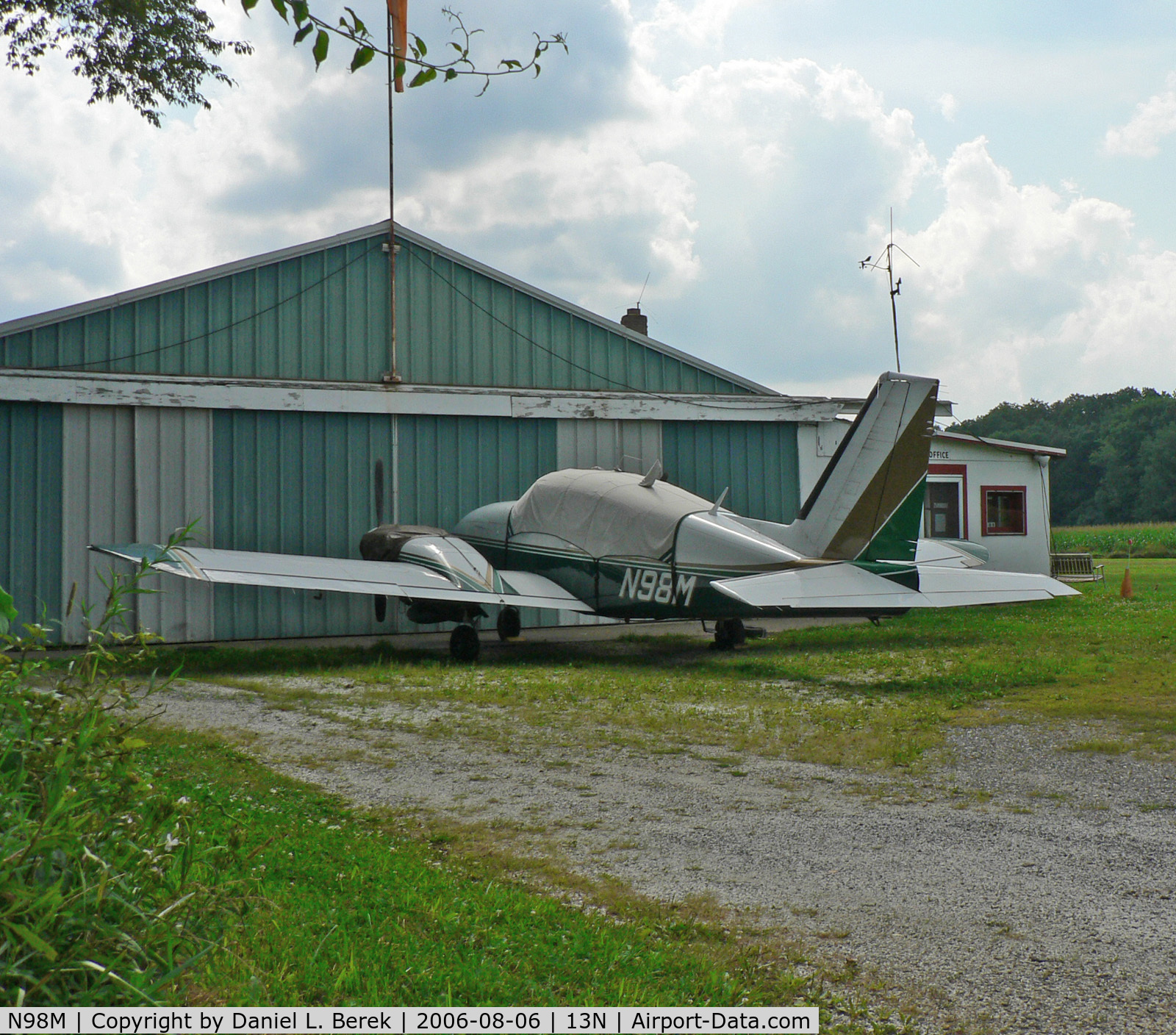 N98M, Piper PA-23-250 C/N 27-7554043, Piper Aztec rests in front of Trinca Airport corporate headquarters.
