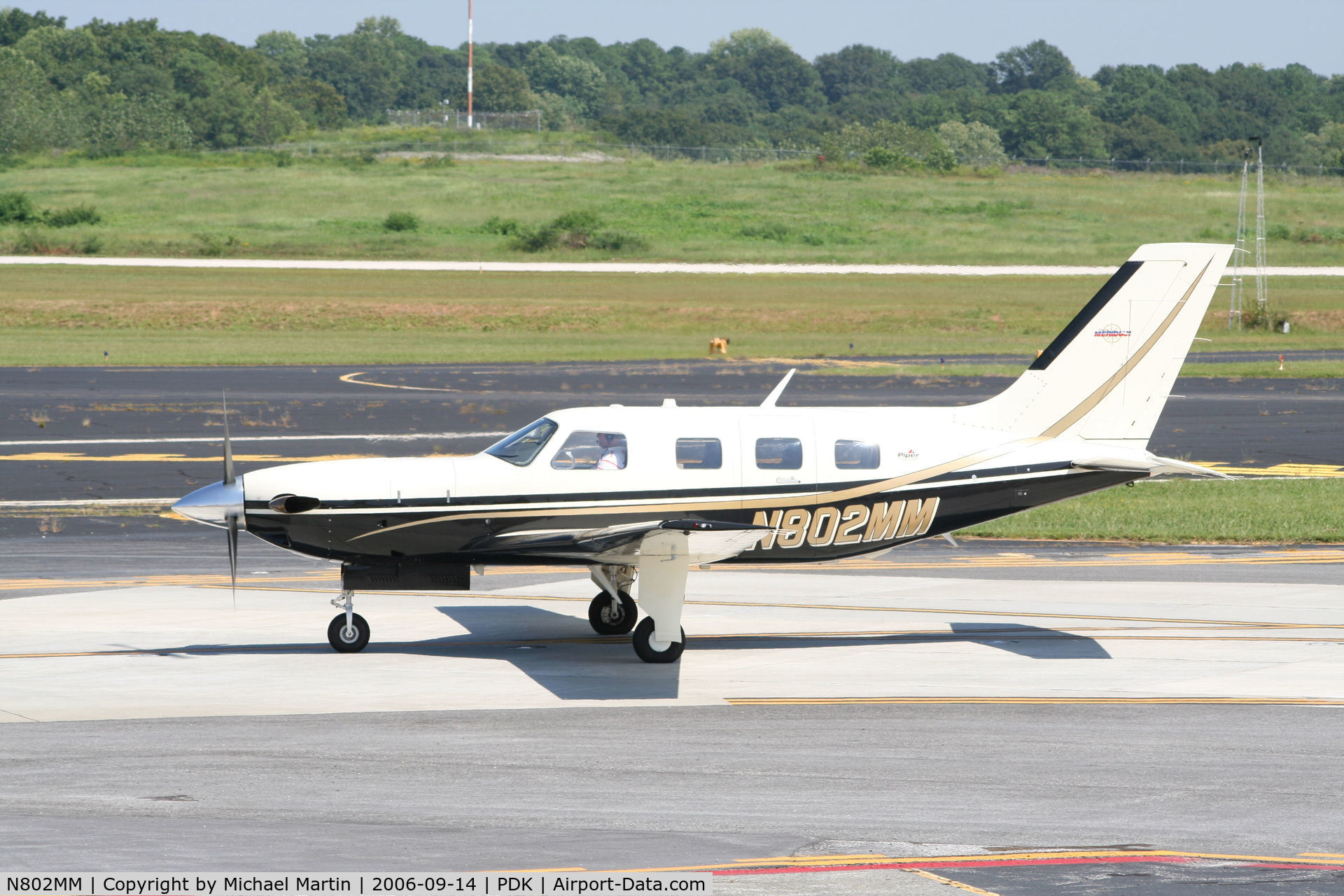 N802MM, 2002 Piper PA-46-500TP Malibu Meridian C/N 4697148, Taxing past Mercury Air Service