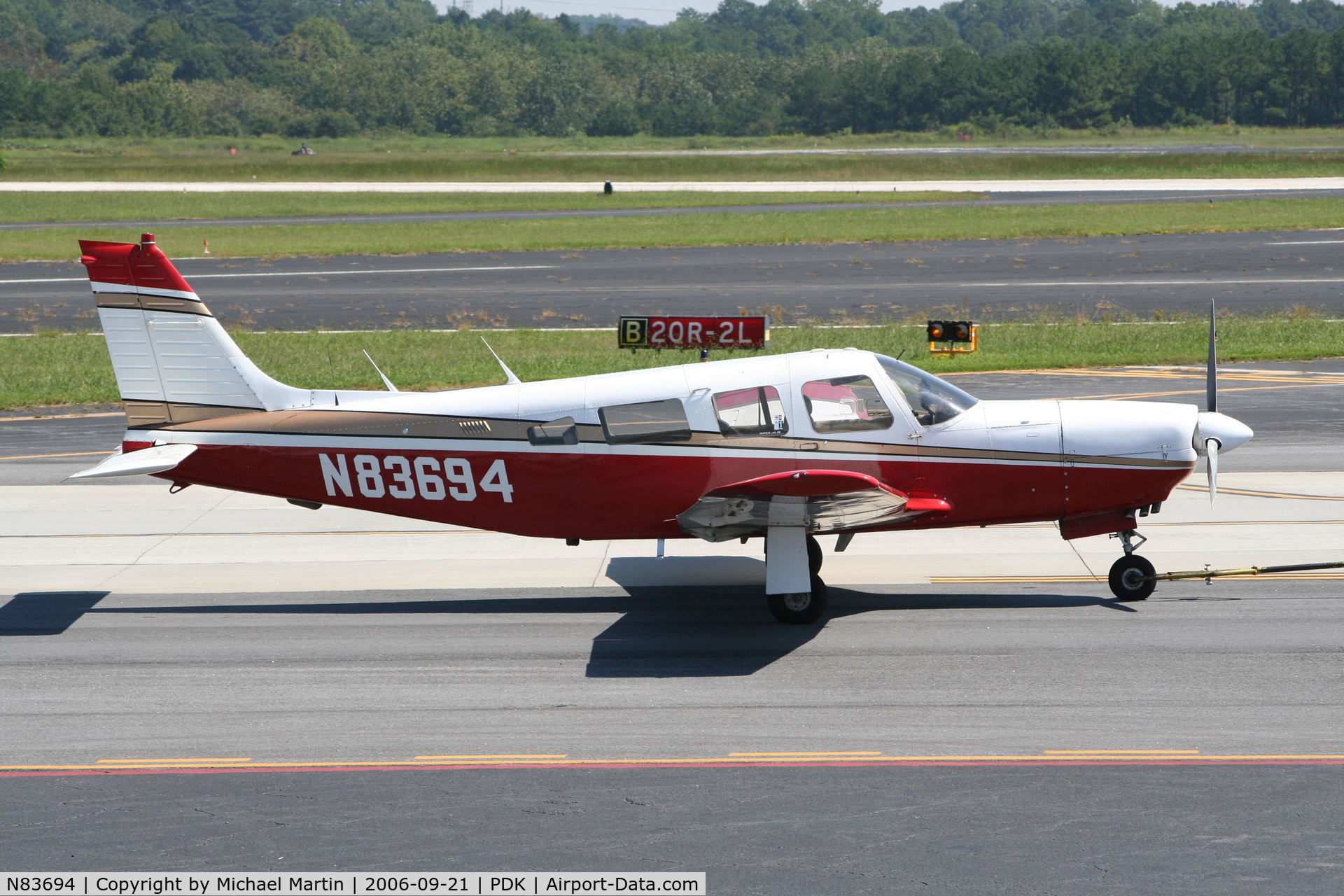 N83694, 1981 Piper PA-32R-301 Saratoga SP C/N 32R-8113060, Being towed to parking at Mercury Air Center