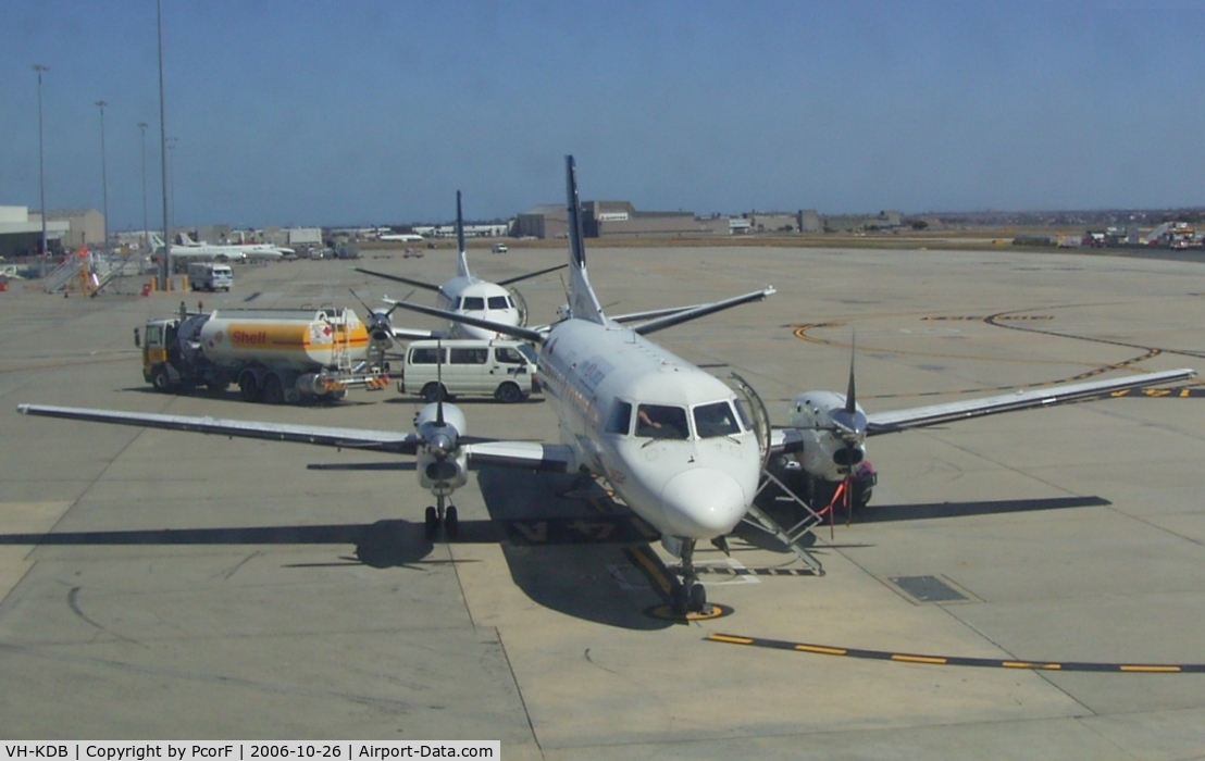 VH-KDB, 1984 Saab-Fairchild SF340 C/N 340A-008, KDB waiting for passengers while Saab 340B VH-RXN is behind.