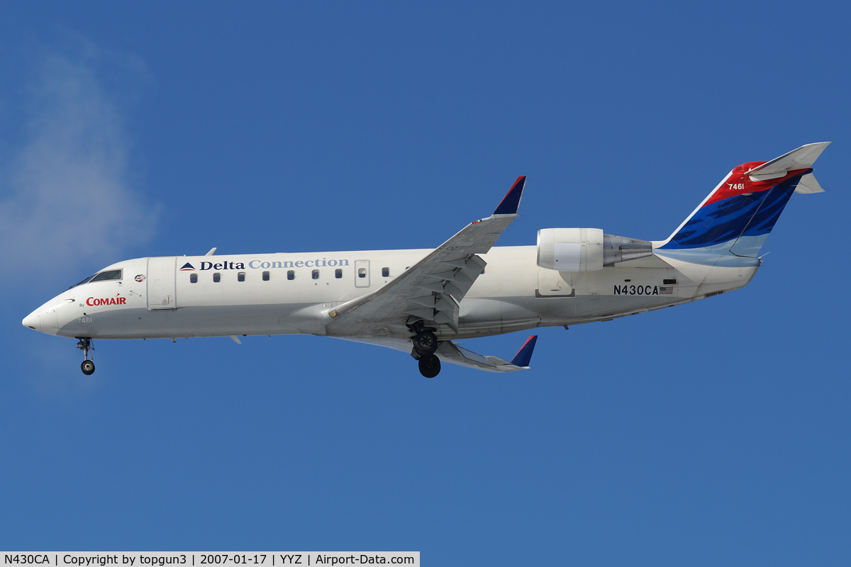 N430CA, 2000 Bombardier CRJ-100ER (CL-600-2B19) C/N 7461, Short final for RWY24L.