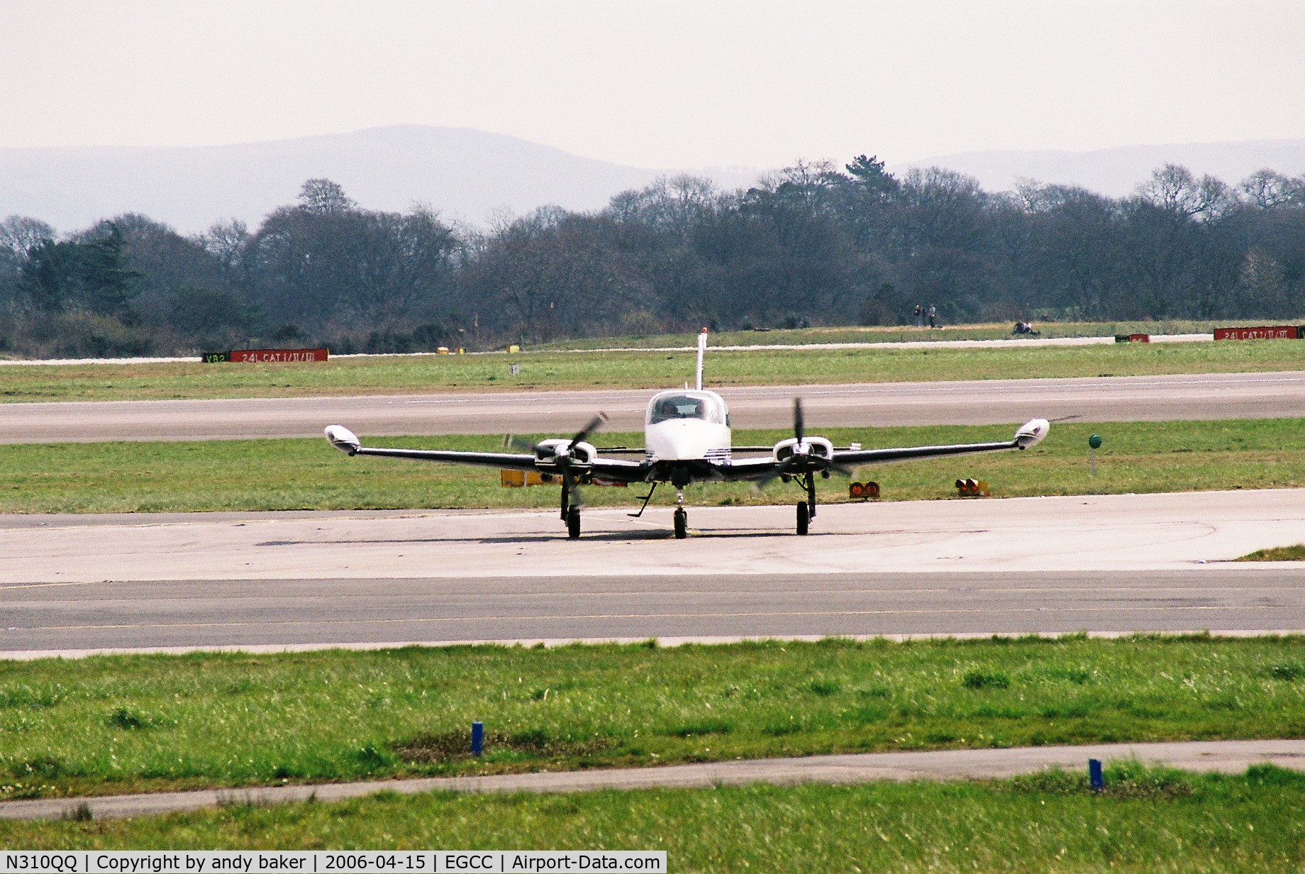 N310QQ, 1973 Cessna 310Q C/N 310Q0695, aircraft just runway [24R] heading for the [NEA]ramp shot taken from [AVP].