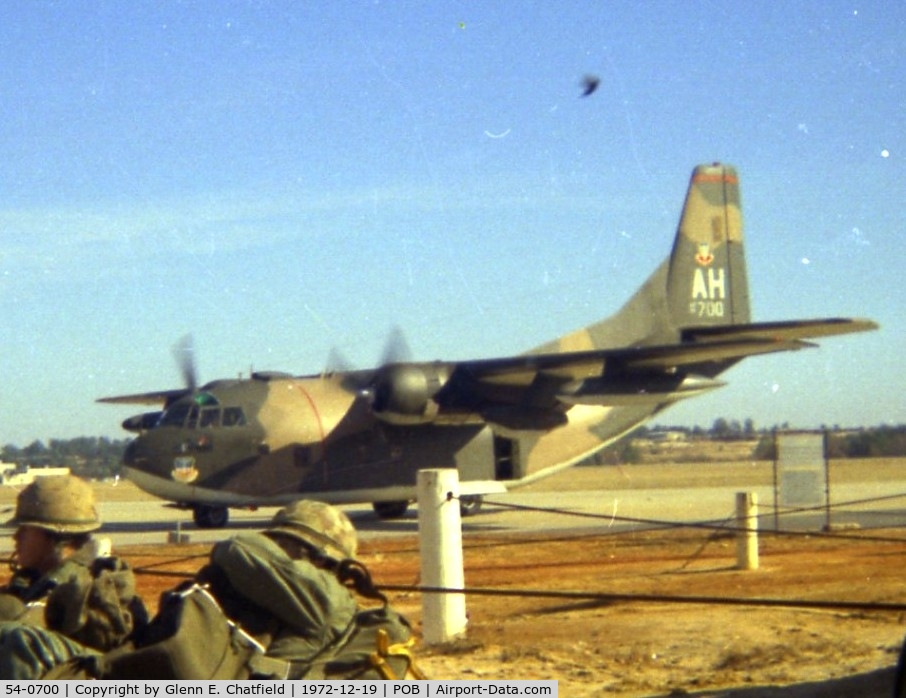 54-0700, 1954 Fairchild C-123K Provider C/N 20149, C-123K passing us troops waiting for loading into C-130