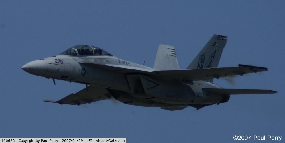 166623, Boeing F/A-18F Super Hornet C/N F116, High speed pass, and vapor is forming on the wing protuberances