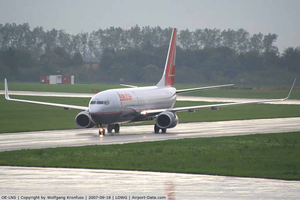OE-LNS, 2005 Boeing 737-8Z9 C/N 34262, taxiing in after a rainy landing
