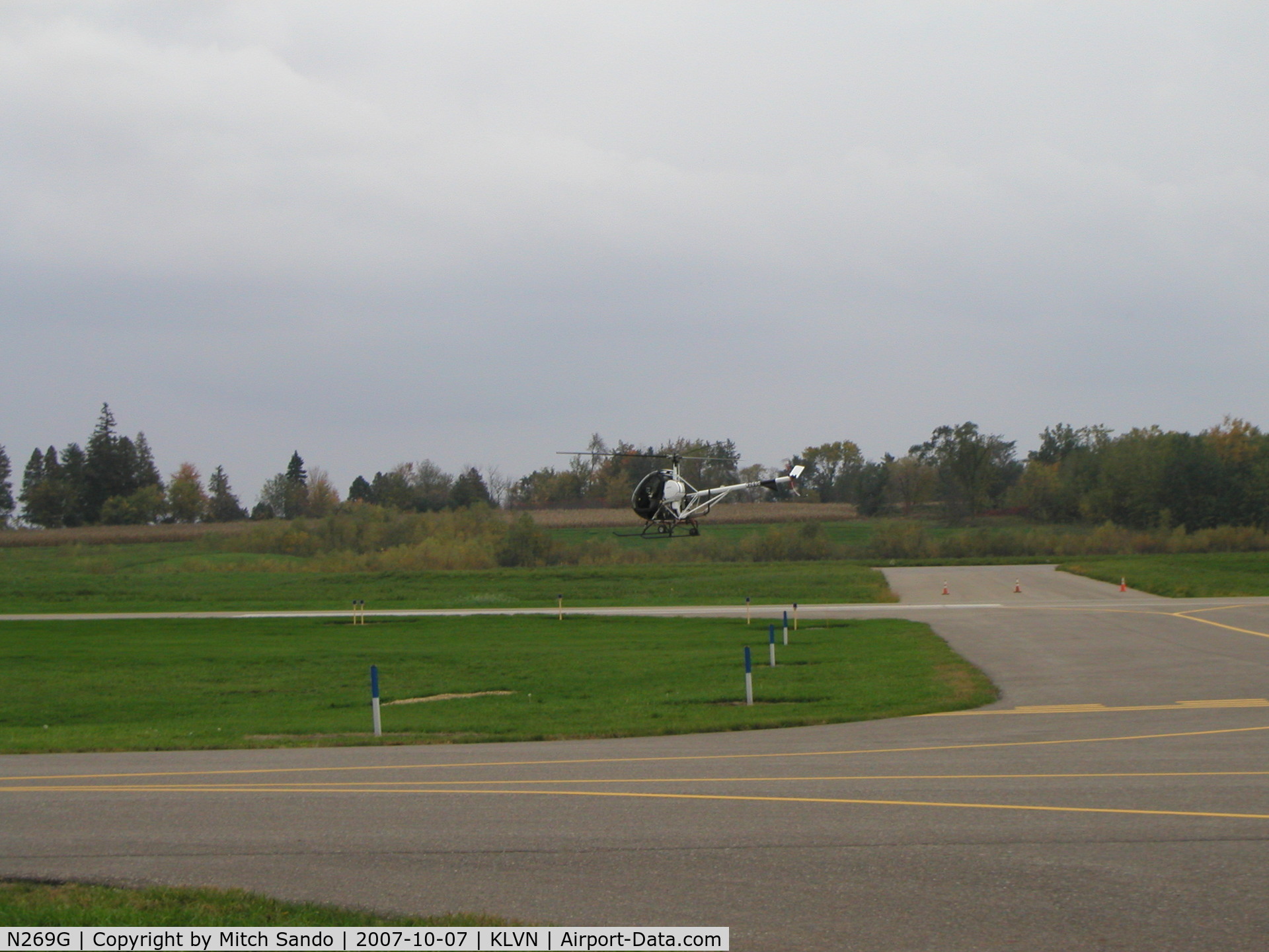 N269G, 2006 Schweizer 269C-1 C/N 0268, Practicing hovering maneuvers south of Runway 12.