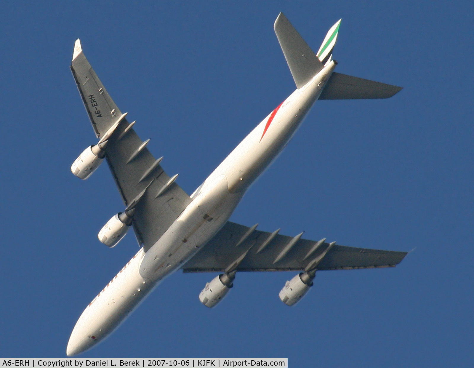 A6-ERH, 2004 Airbus A340-541 C/N 611, An Italian Boeing Triple-7 glides serenly over New Jersey's Sandy Hook on it approach to JFK.