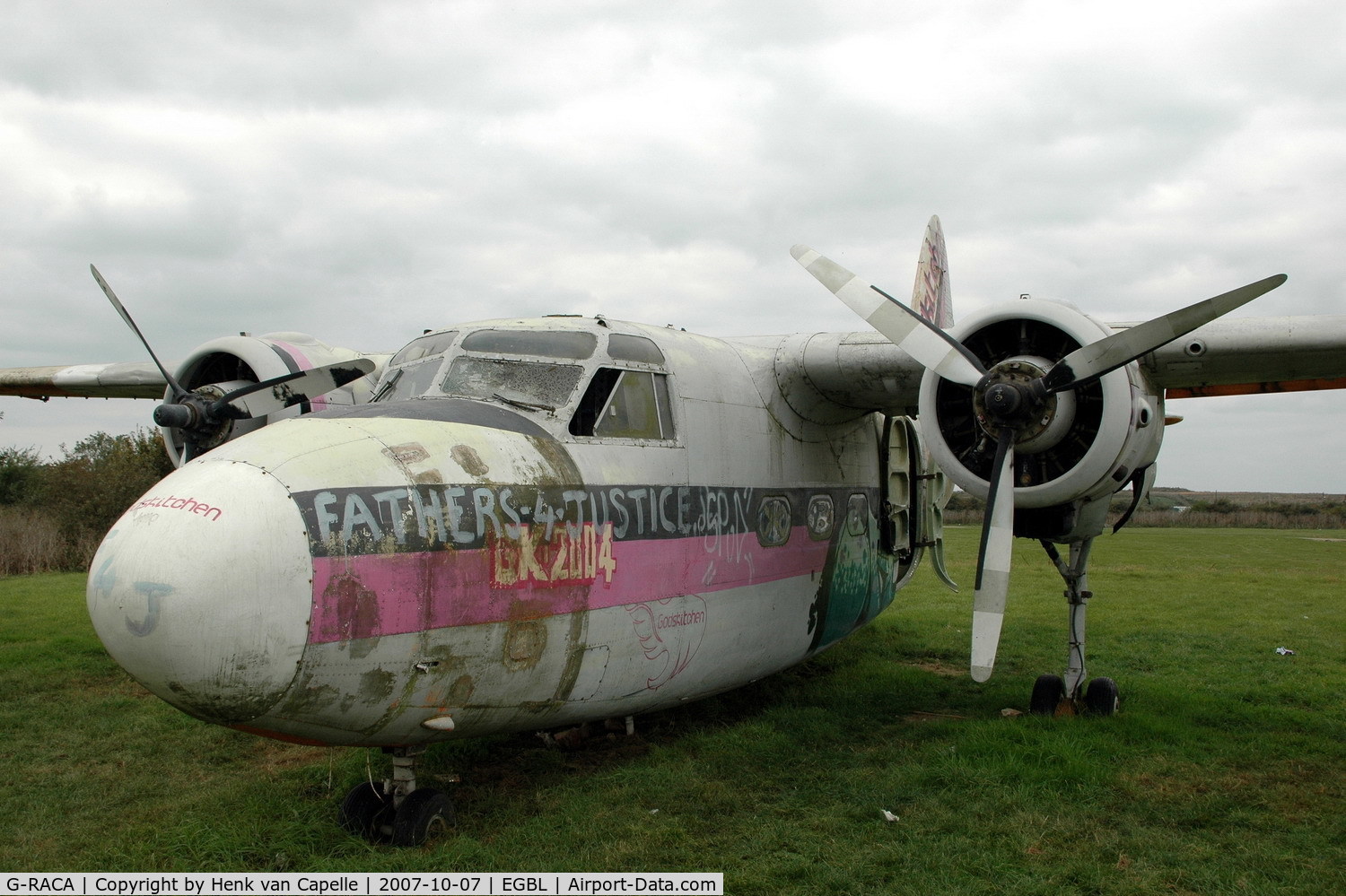 G-RACA, 1952 Percival P-57 Sea Prince T1 C/N P57/49, Falling apart: this Sea Prince is now sort of a gate guard at Long Marston, with the Gods Kitchen paint job apparantly the result of a music festival.