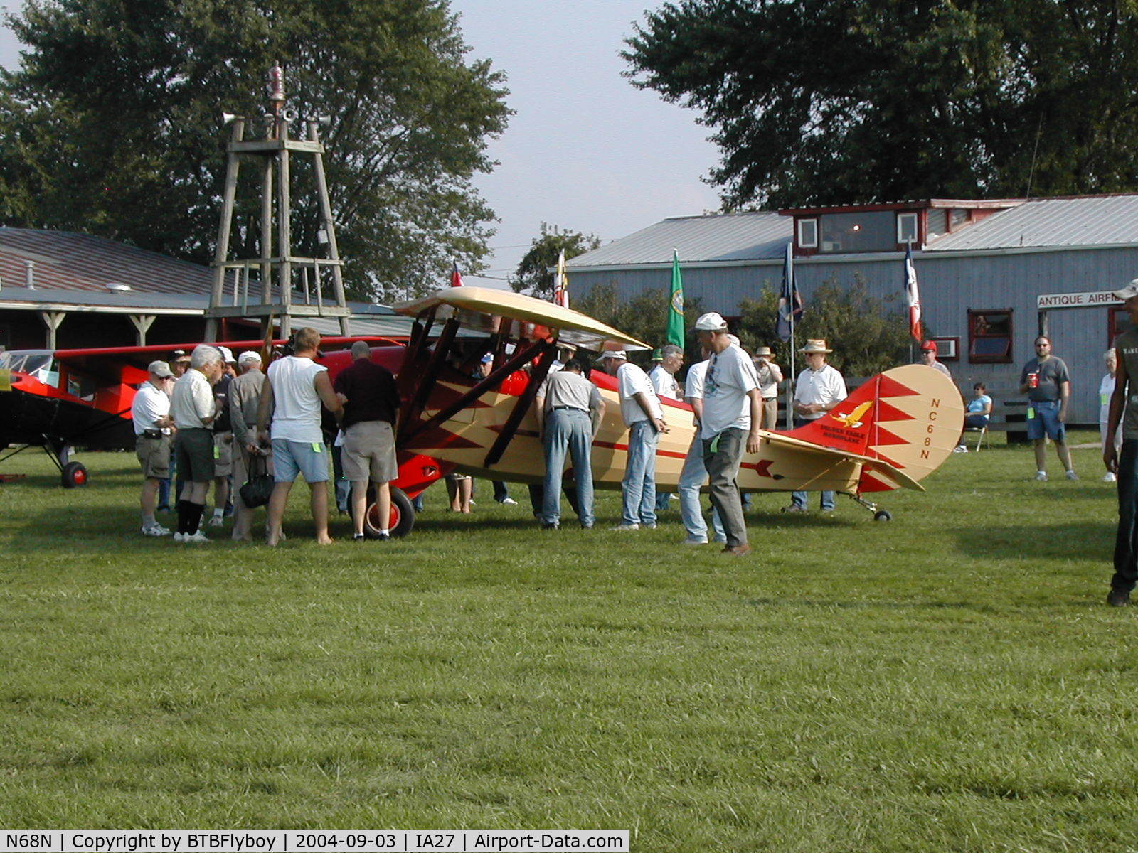 N68N, 1929 Golden Eagle Chief C/N 803, A crowd gathers round the rare Golden Eagle Chief shortly after landing at Antique Airfield near Blakesburg, IA during the 2004 AAA/APM National Fly-in