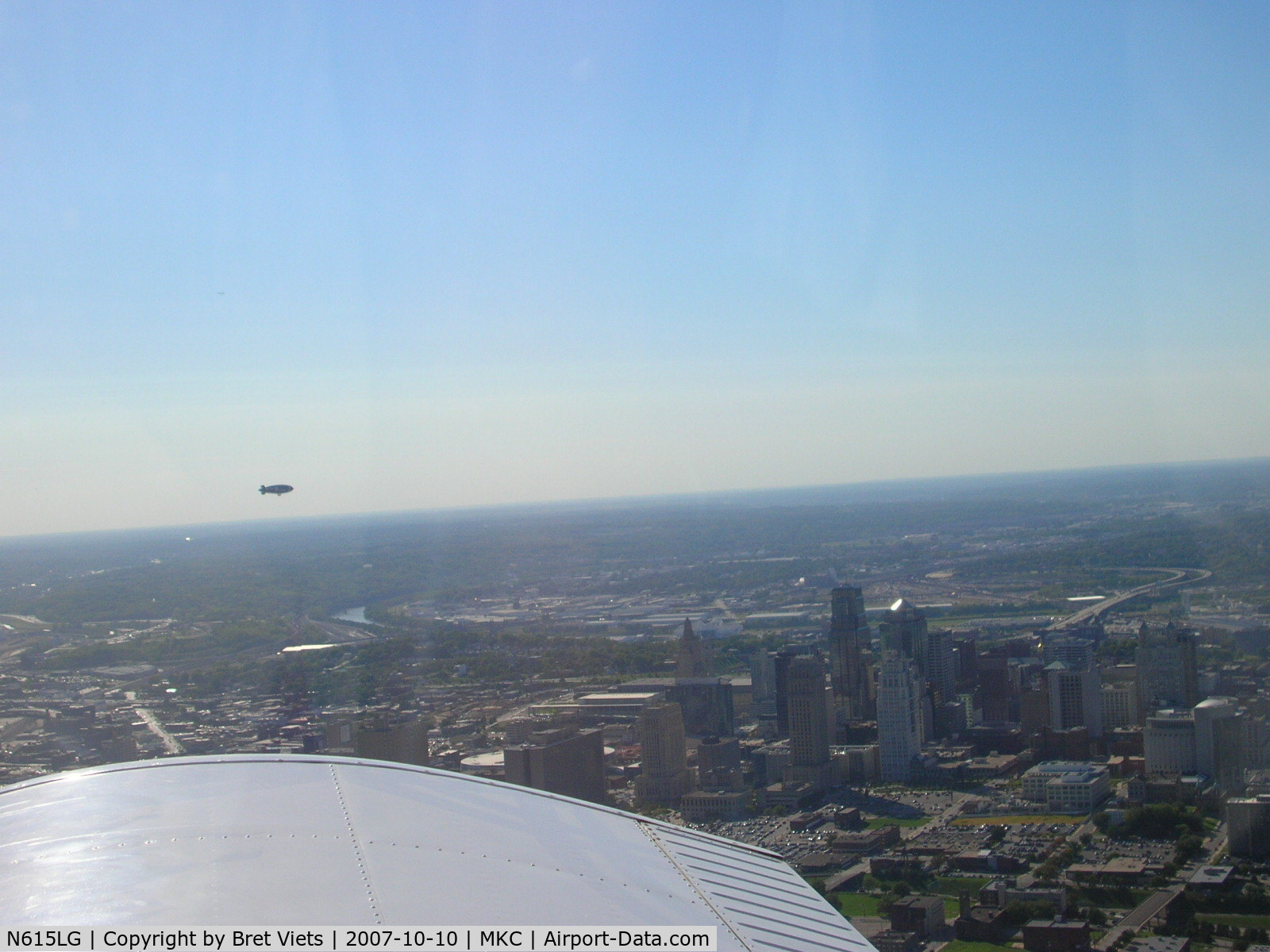 N615LG, 1997 American Blimp Corp A60R C/N 015, Snoopy 2 over downtown K.C. Missouri