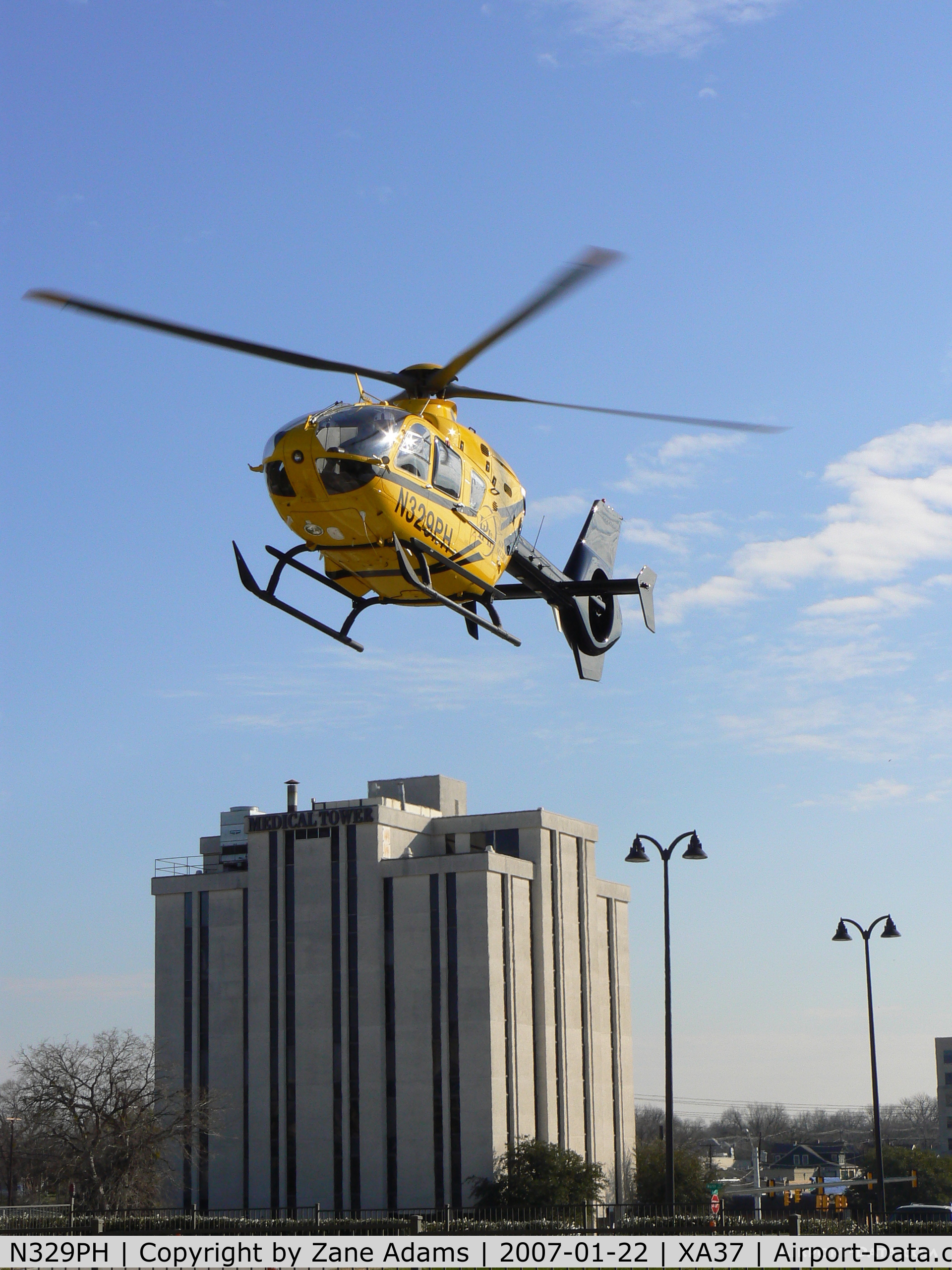 N329PH, 2006 Eurocopter EC-135P-2 C/N 0489, Leaving hospital pad in the medical district @ Ft. Worth, TX