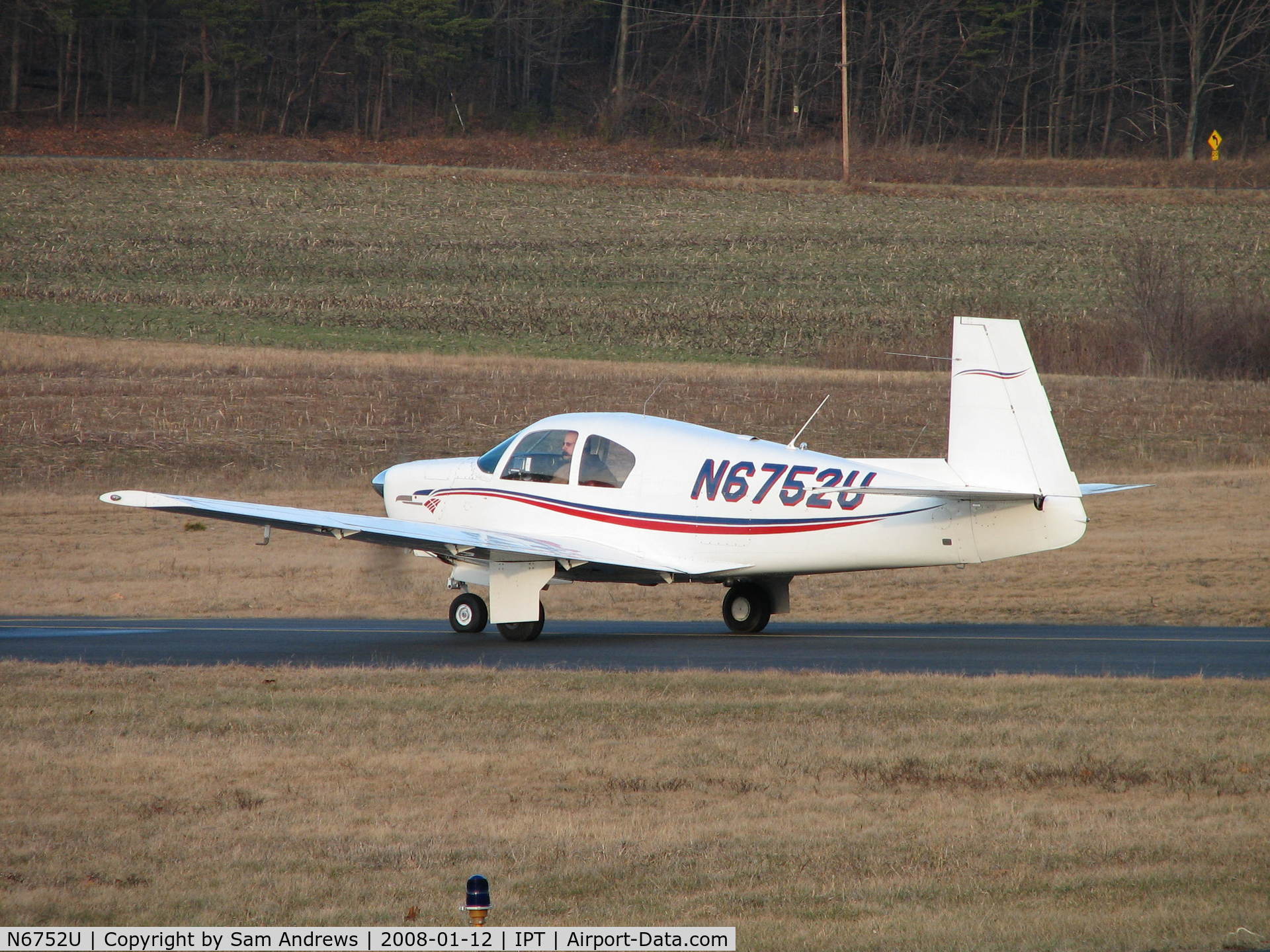 N6752U, 1963 Mooney M20C Ranger C/N 2474, Waiting for the guy that just landed to get clear of the runway.