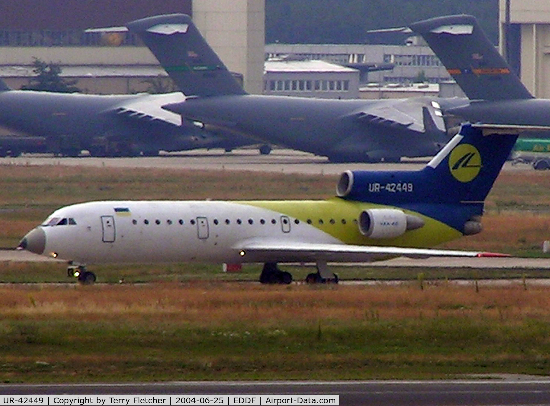 UR-42449, 1994 Yakovlev Yak-42D C/N 1401018, Yak42 arrives at Frankfurt against the backdrop of USAF aircraft