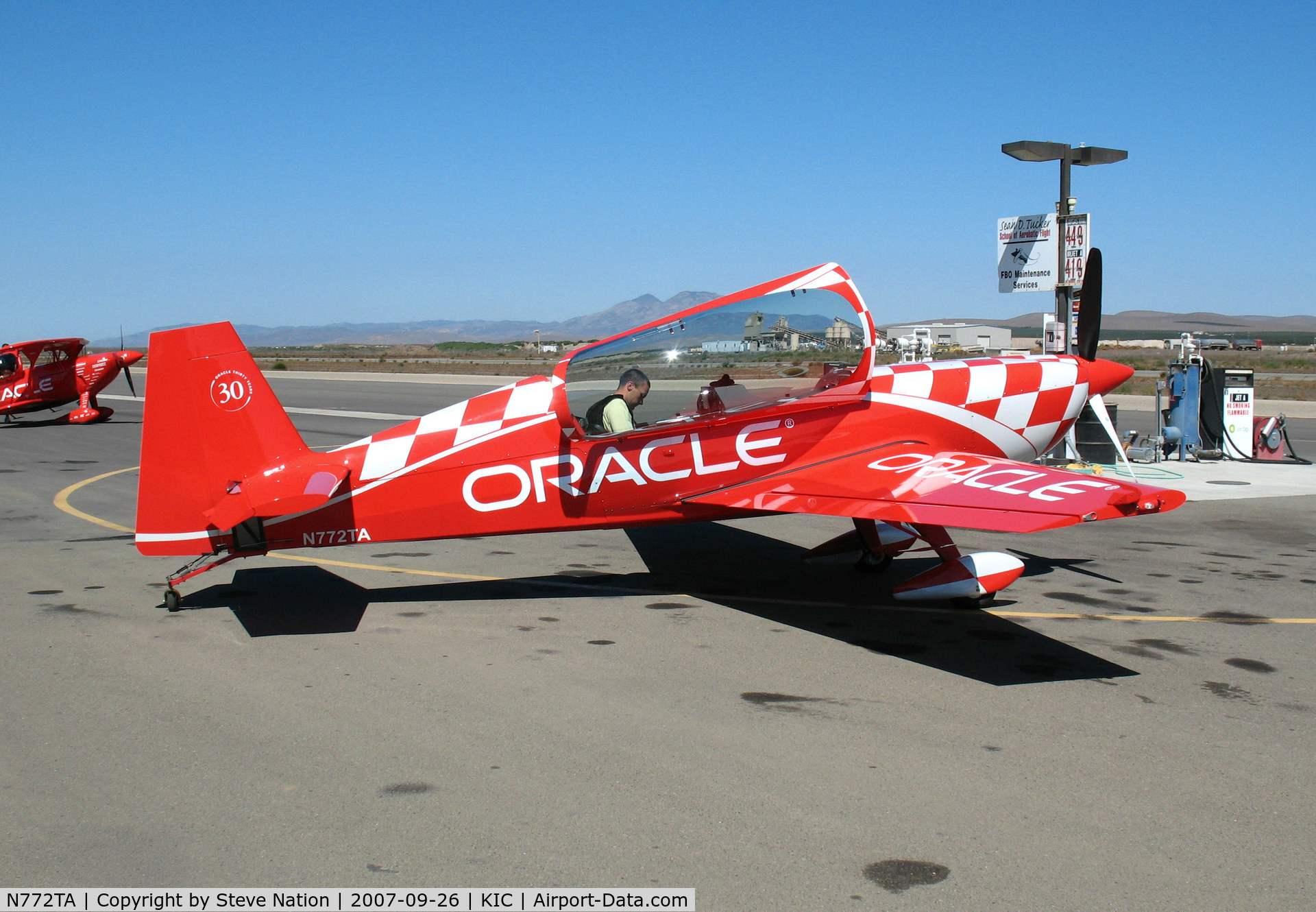 N772TA, 2007 Extra EA-300/L C/N 1260, Strapping-in to brightly painted (Team) ORACLE 2006 Extra Flugzeugbau Gmbh EA 300/L @ Mesa del Rey (King City) Airport, CA