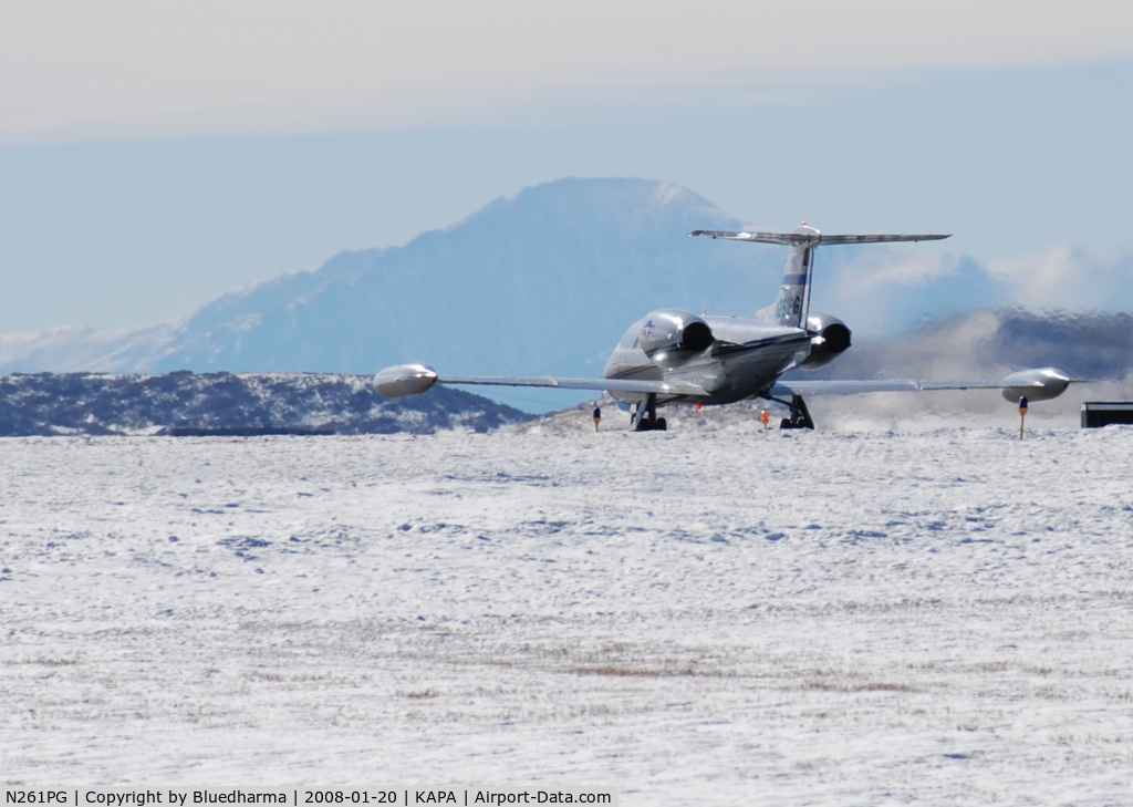 N261PG, 1980 Gates Learjet 35A C/N 329, Takeoff on 17L with Pikes Peak in the background.