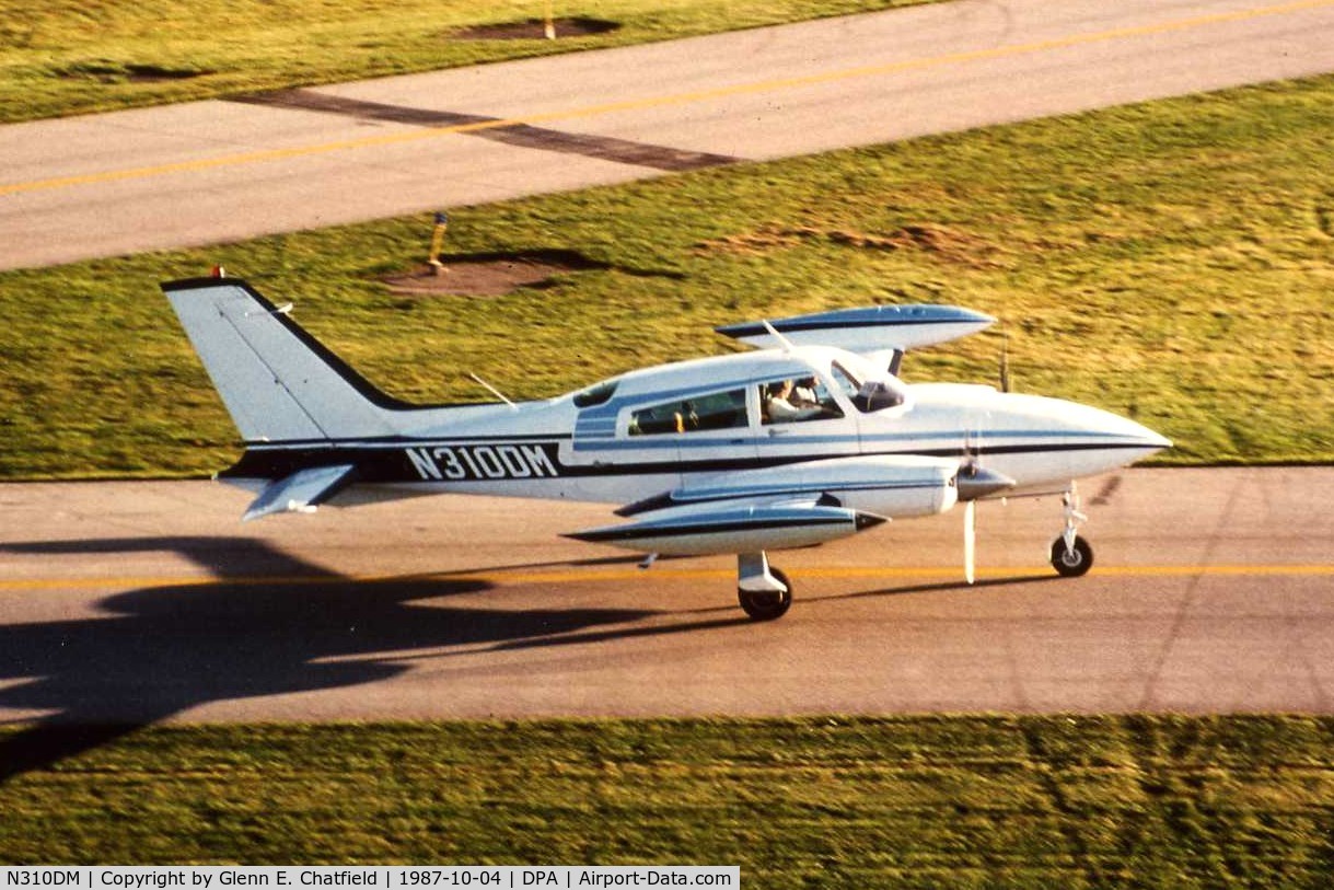 N310DM, 1976 Cessna 310R C/N 310R0641, Photo taken for aircraft recognition training.  C310 taxiing by the control tower