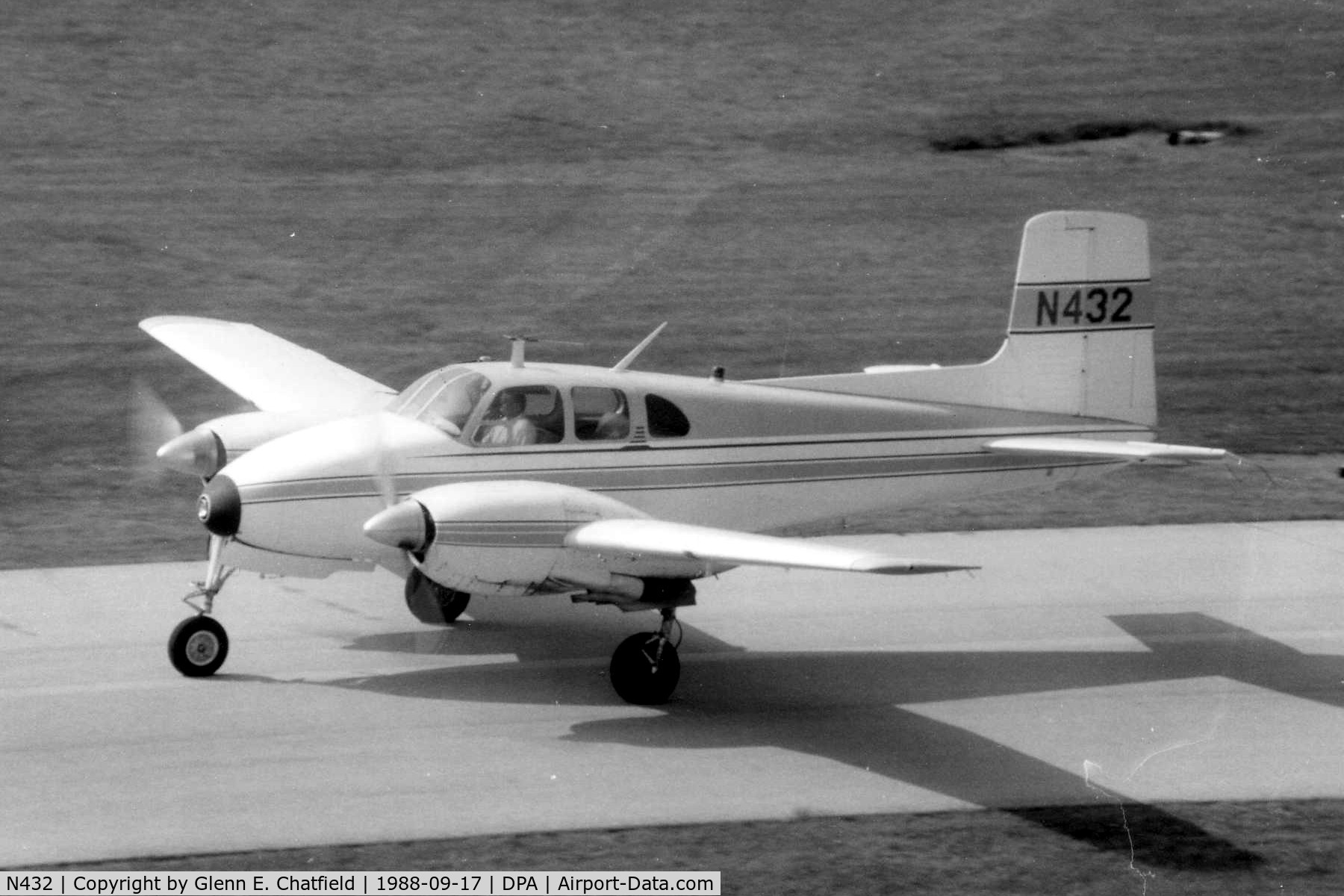 N432, 1955 Beech C-50 Twin Bonanza C/N CH-160, Photo taken for aircraft recognition training.  Taxiing by the control tower.