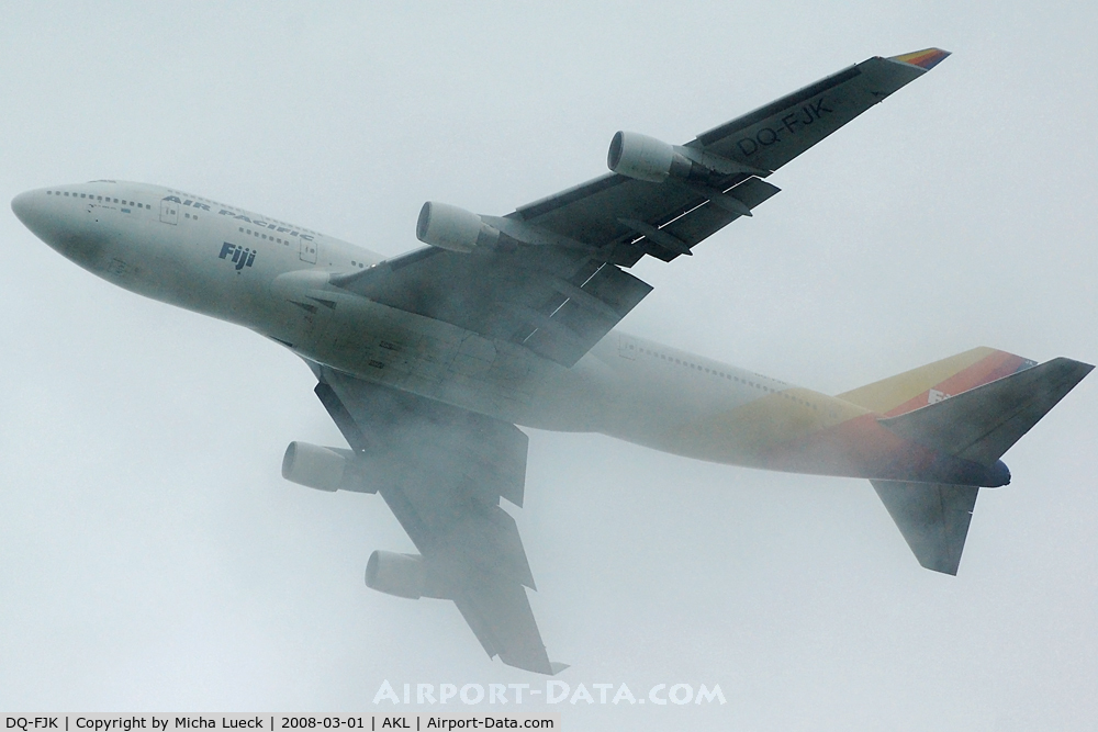 DQ-FJK, 1989 Boeing 747-412 C/N 24064, Disappearing in the rain clouds...