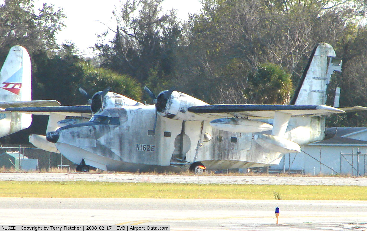 N16ZE, Grumman HU-16E Albatross C/N 2124, This Grumman HU-16E appears to show its age , stuck in the SE corner of New Smyrna Beach airport