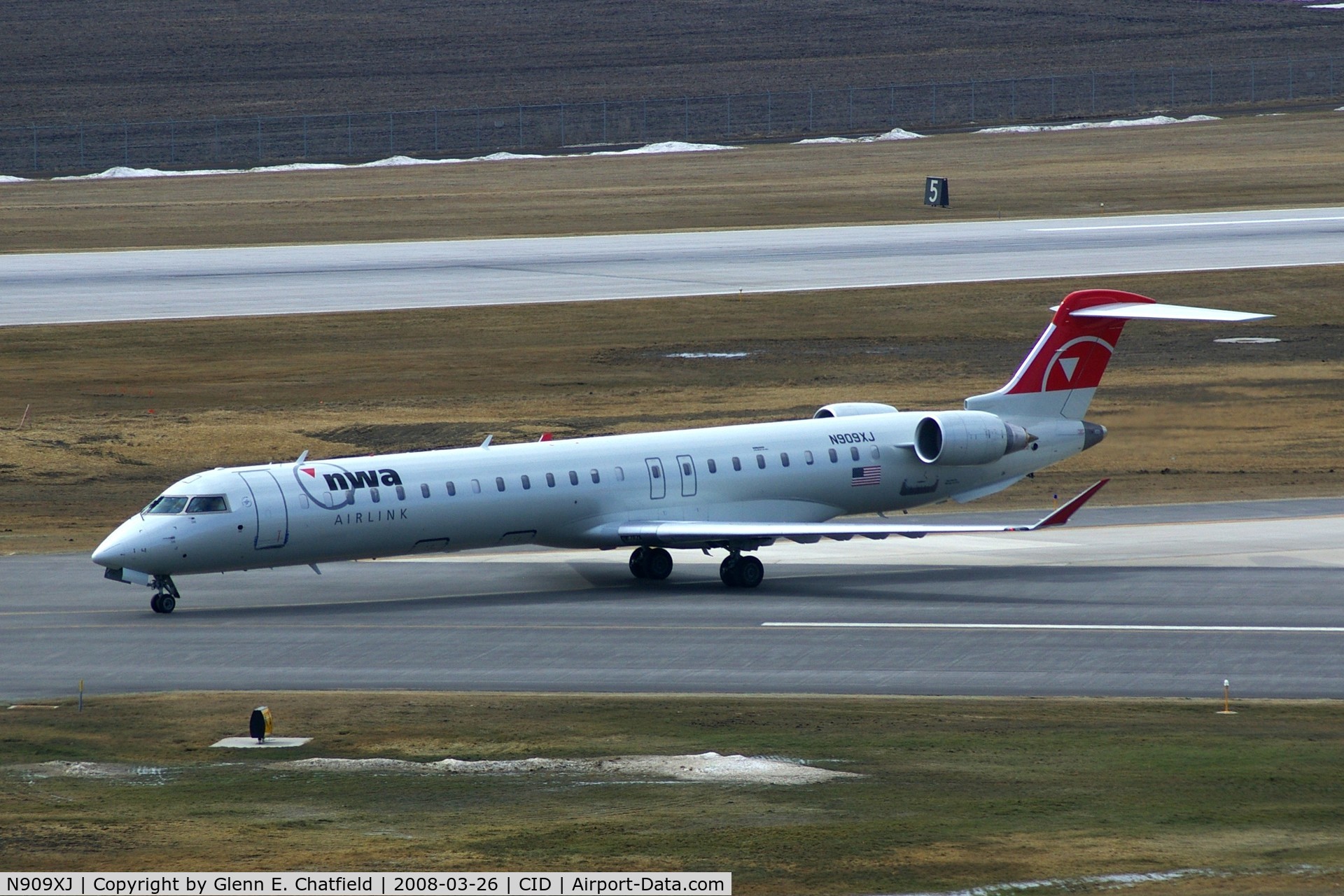 N909XJ, 2007 Bombardier CRJ-900ER (CL-600-2D24) C/N 15141, Taxiing inbound on Alpha from Runway 27