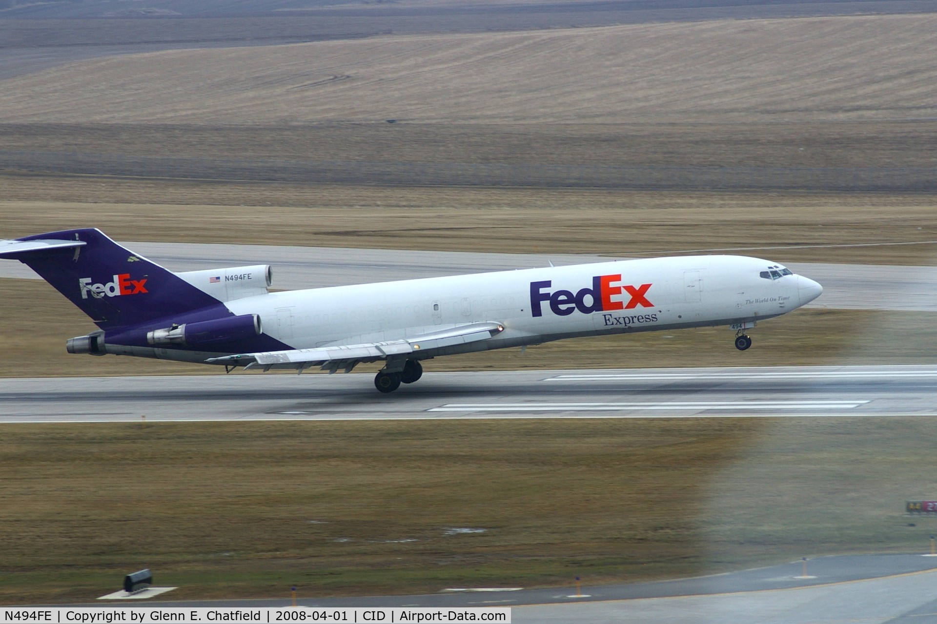 N494FE, 1979 Boeing 727-227 C/N 21532, FDX1464 arriving late.  Mains almost touching the pavement landing Runway 27