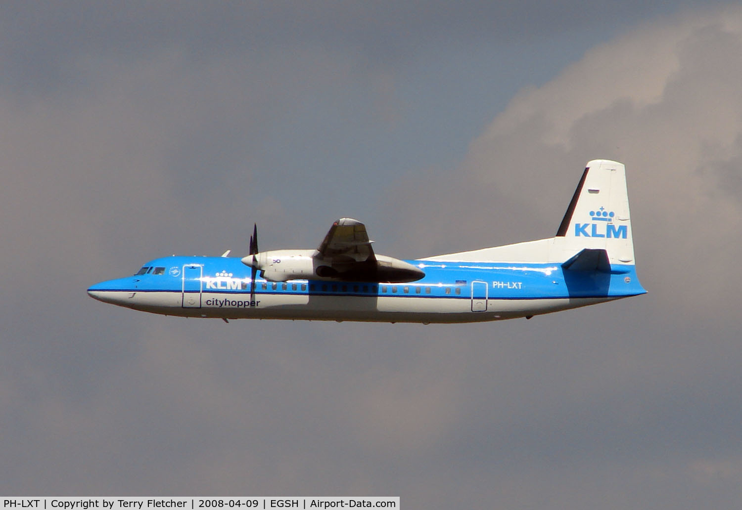 PH-LXT, 1993 Fokker 50 C/N 20279, KLM Fokker 50 climbs away from Norwich UK - one of the few scheduled flights from this East Anglian City