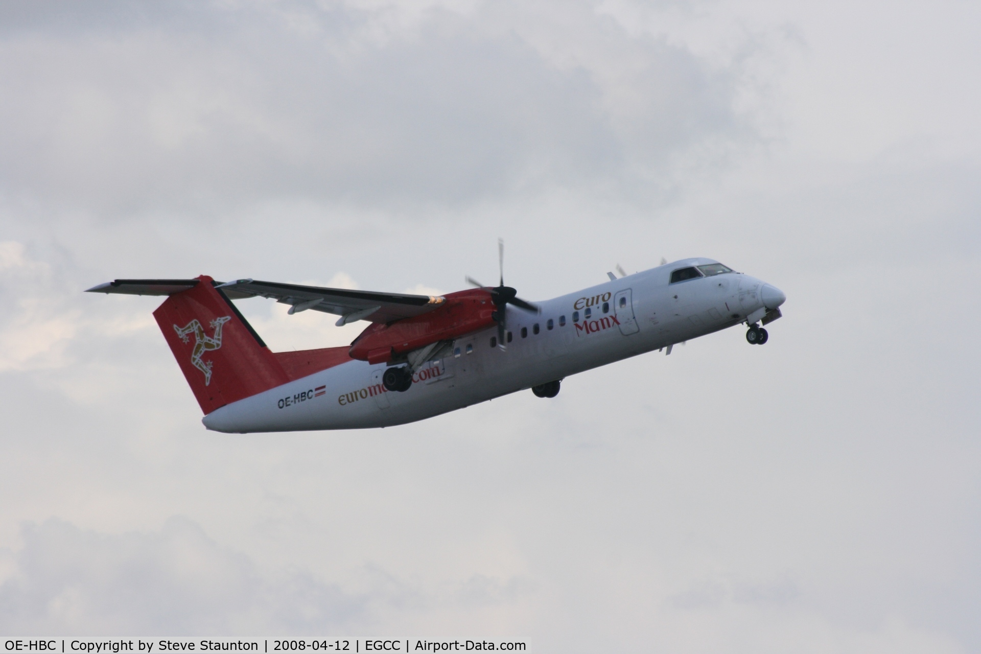 OE-HBC, 1999 De Havilland Canada DHC-8-311 Dash 8 C/N 533, Taken at Manchester Airport on a typical showery April day