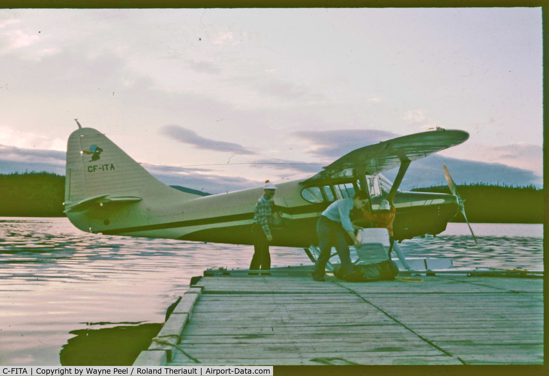 C-FITA, 1949 Stinson 108-3 Voyager C/N 108 3968, Bob Peel with daughter Wendy & granddaughter Kathy loading up at Lac des Rapides, Sept Iles, Quebec; mid 70's