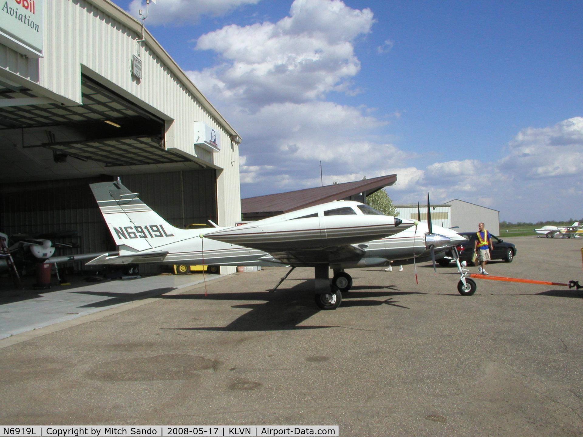 N6919L, 1965 Cessna 310K C/N 310K0019, Getting towed out of the maintenance hangar to run-up the engines.