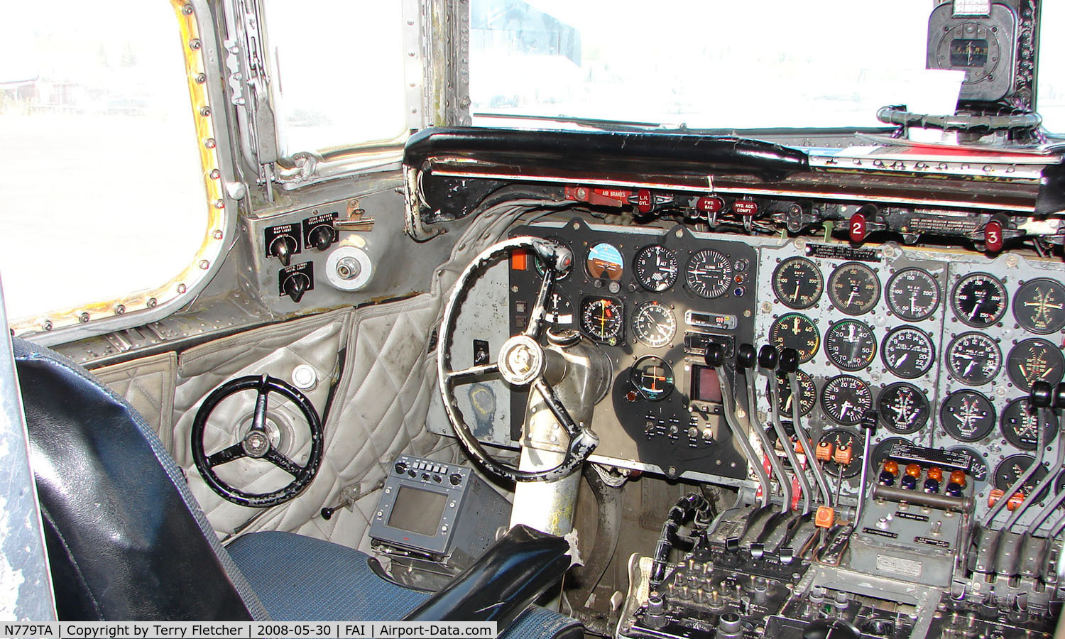 N779TA, 1958 Douglas DC-6A/C C/N 45529, A view inside the cockpit of this classic airliner