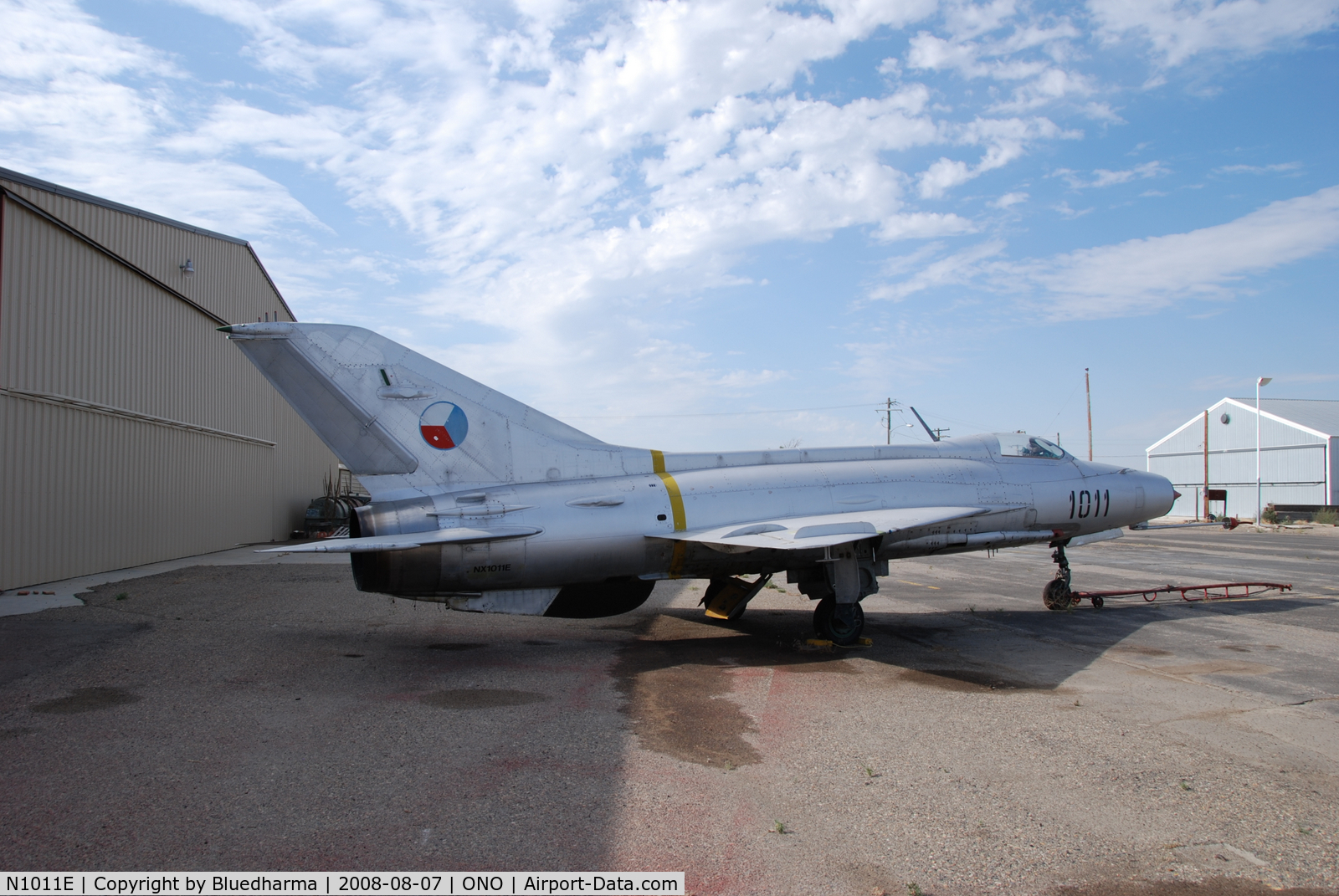 N1011E, Mikoyan-Gurevich MiG-21F-13 C/N 1011, Parked by hanger at airport.