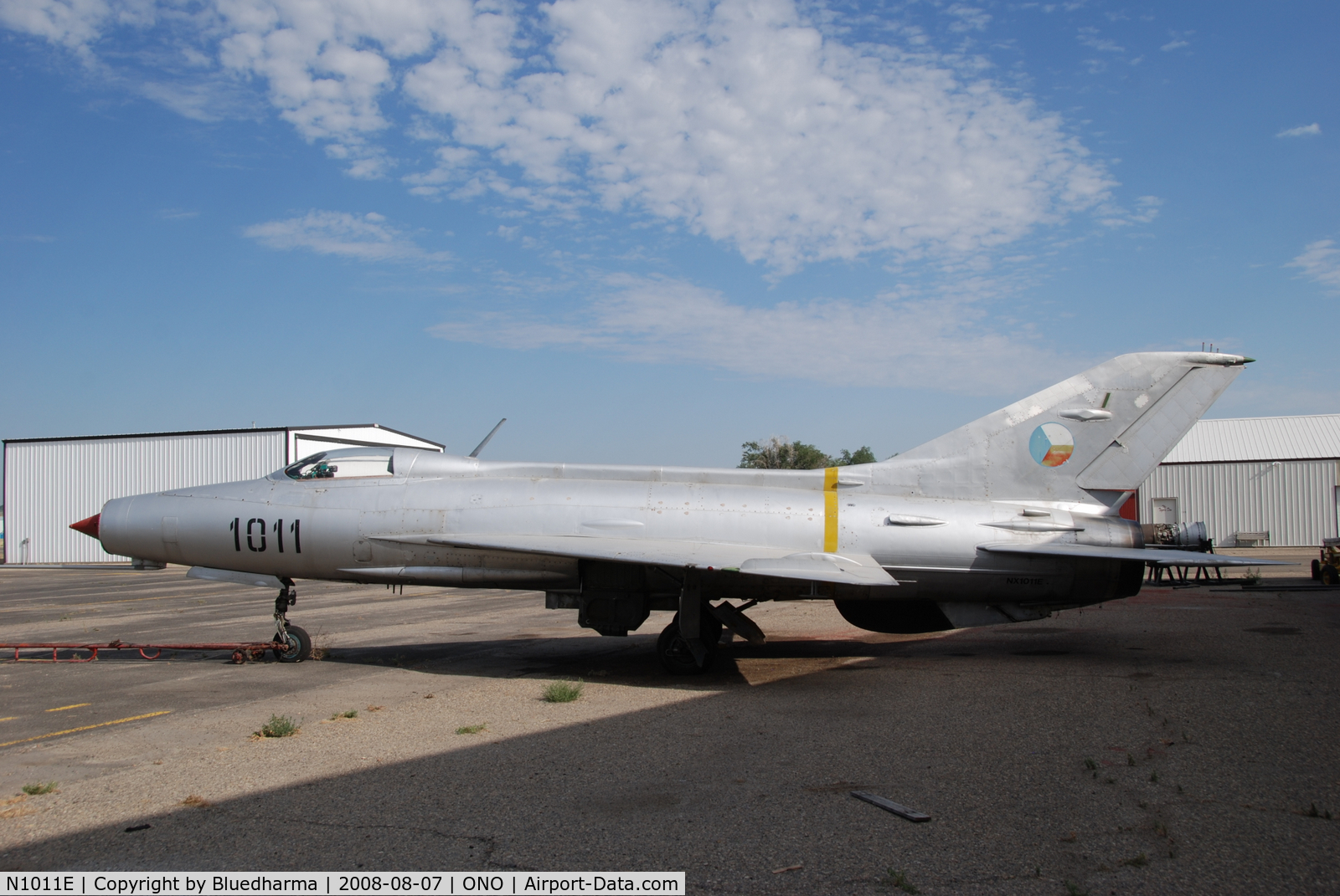 N1011E, Mikoyan-Gurevich MiG-21F-13 C/N 1011, Parked by hanger at airport.