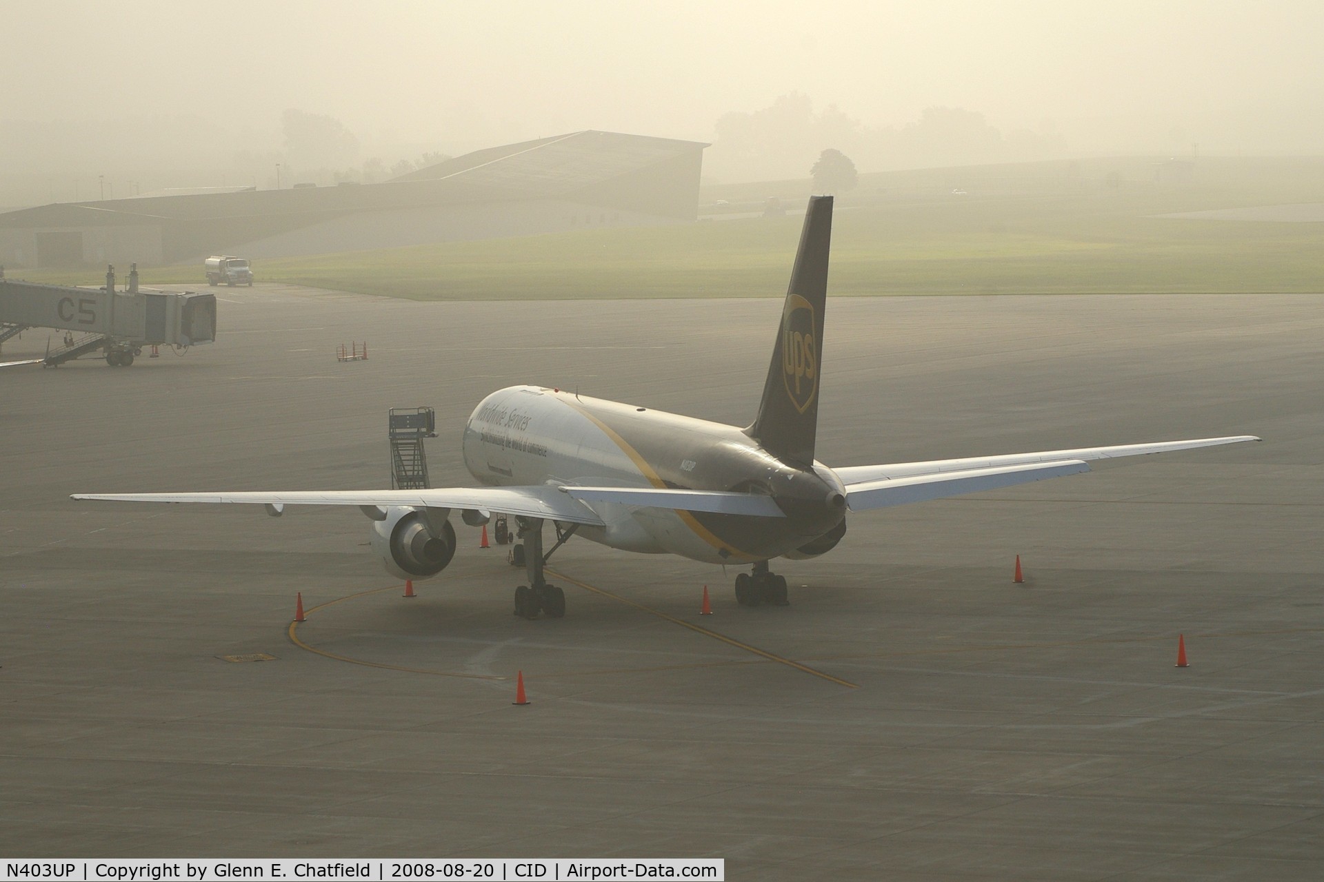N403UP, 1987 Boeing 757-24APF C/N 23725, Early morning fog on the UPS ramp.  Fog is clearing