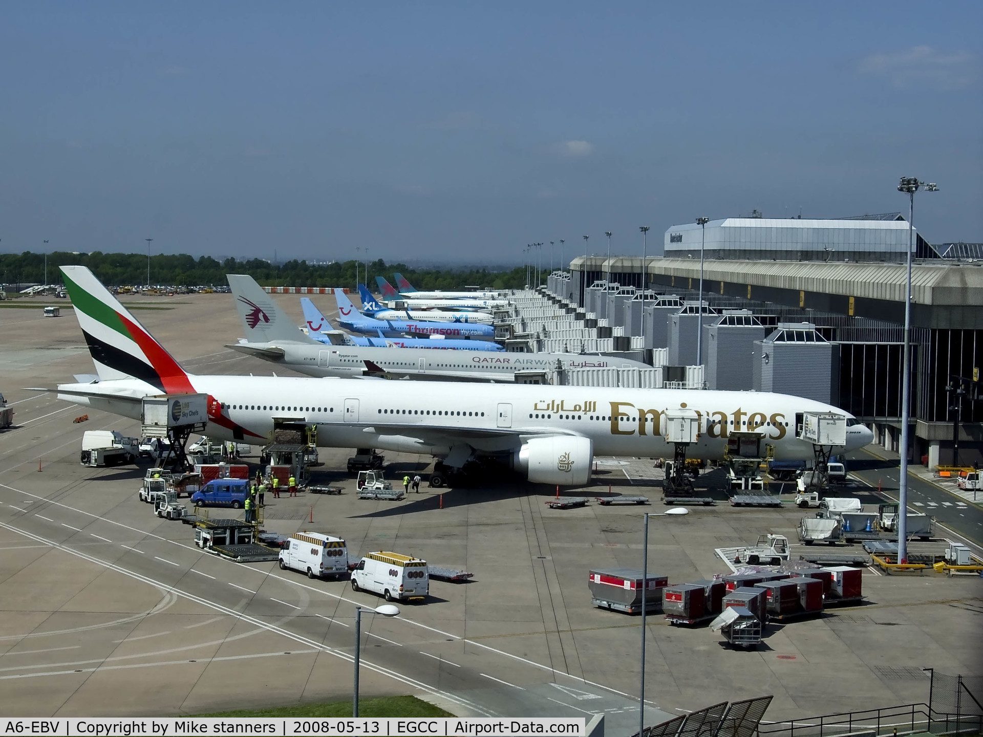 A6-EBV, 2006 Boeing 777-31H/ER C/N 32728, Emirates B777 surrounded by equipment at Manchester
