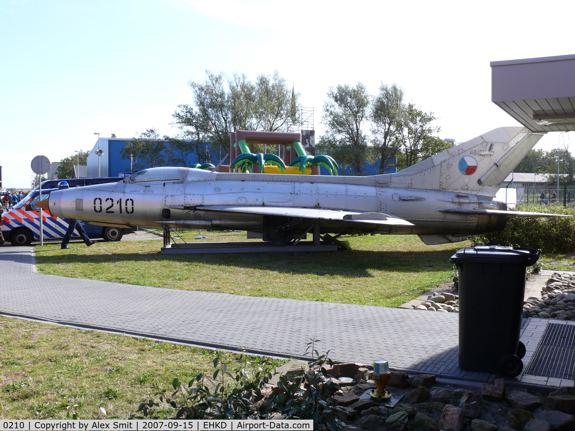 0210, Mikoyan-Gurevich MiG-21F-13 C/N 460210, Mig21 Fishbed on a bed of wood near the tower
