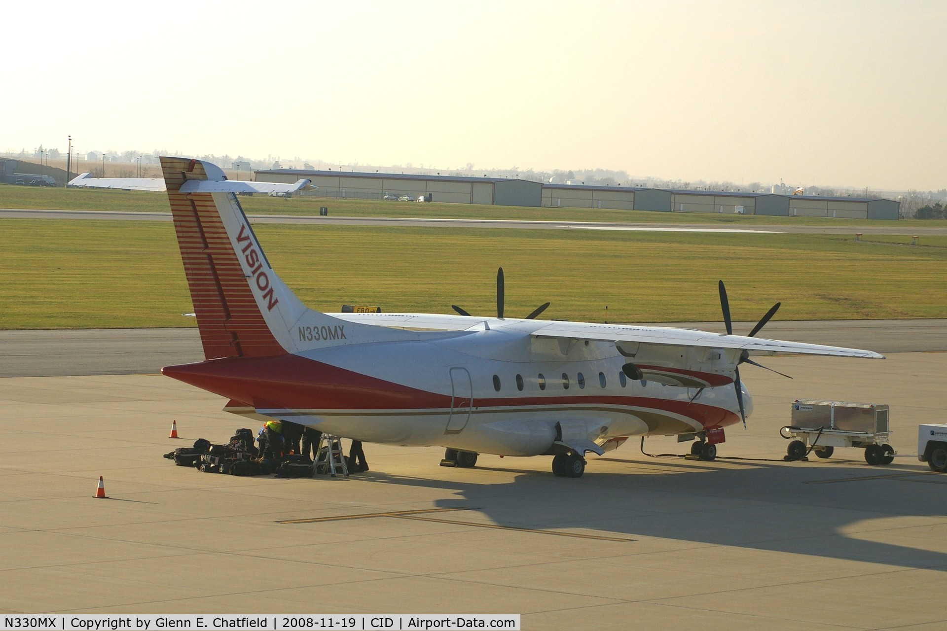 N330MX, 1996 Dornier 328-100 C/N 3067, Loading the team baggage - I don't know which U of Iowa team.