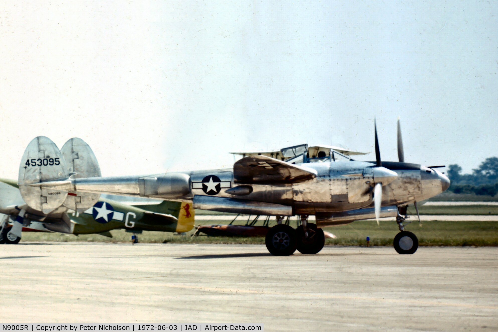 N9005R, 1944 Lockheed P-38M C/N 44-53095, Flown by the Confederate Air Force at Transpo 72 held at Dulles Airport and shows the plain side of the nose of the 