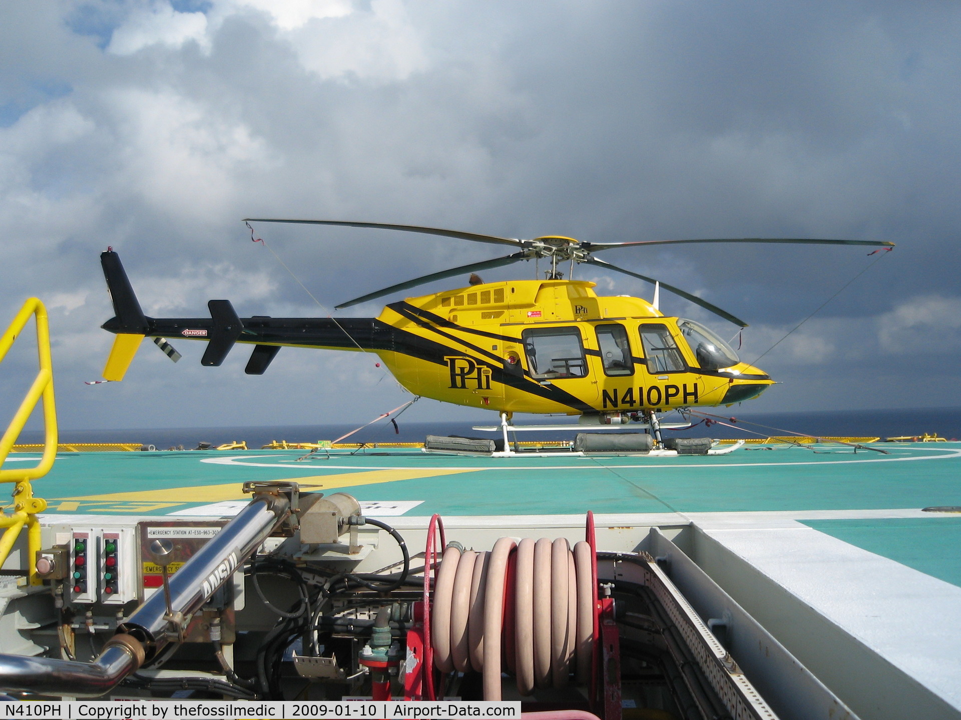 N410PH, 2005 Bell 407 C/N 53636, Sitting on helideck in the Gulf of Mexico