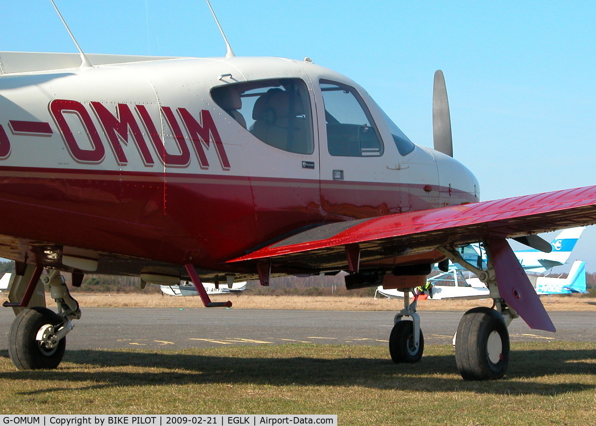 G-OMUM, 1976 Rockwell Commander 114 C/N 14067, PARKED NEXT TO THE REDAIR RAMP